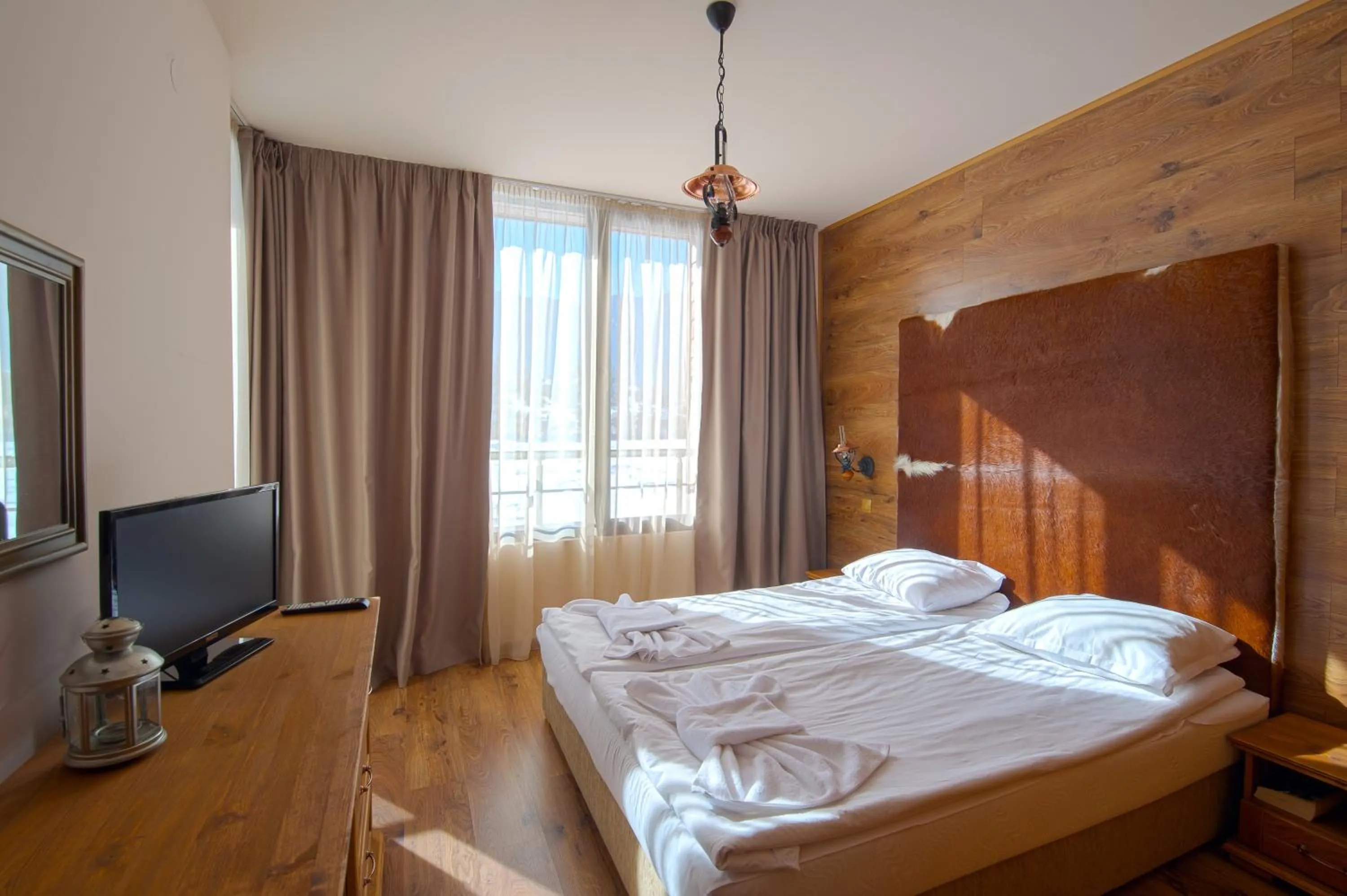 Communal lounge/ TV room, Bed in Cornelia Deluxe Residence