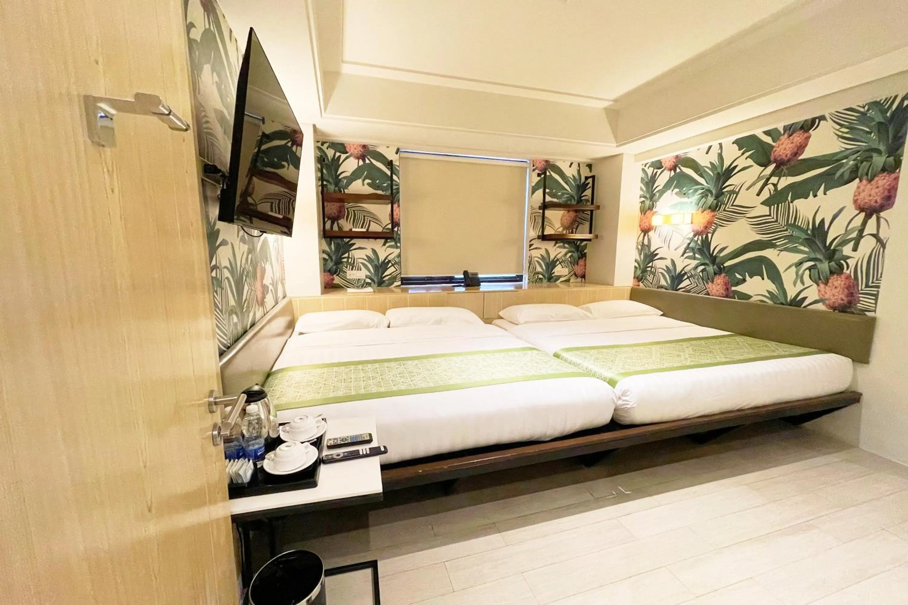 Bed in Mella Hotel Manila near NAIA Airport