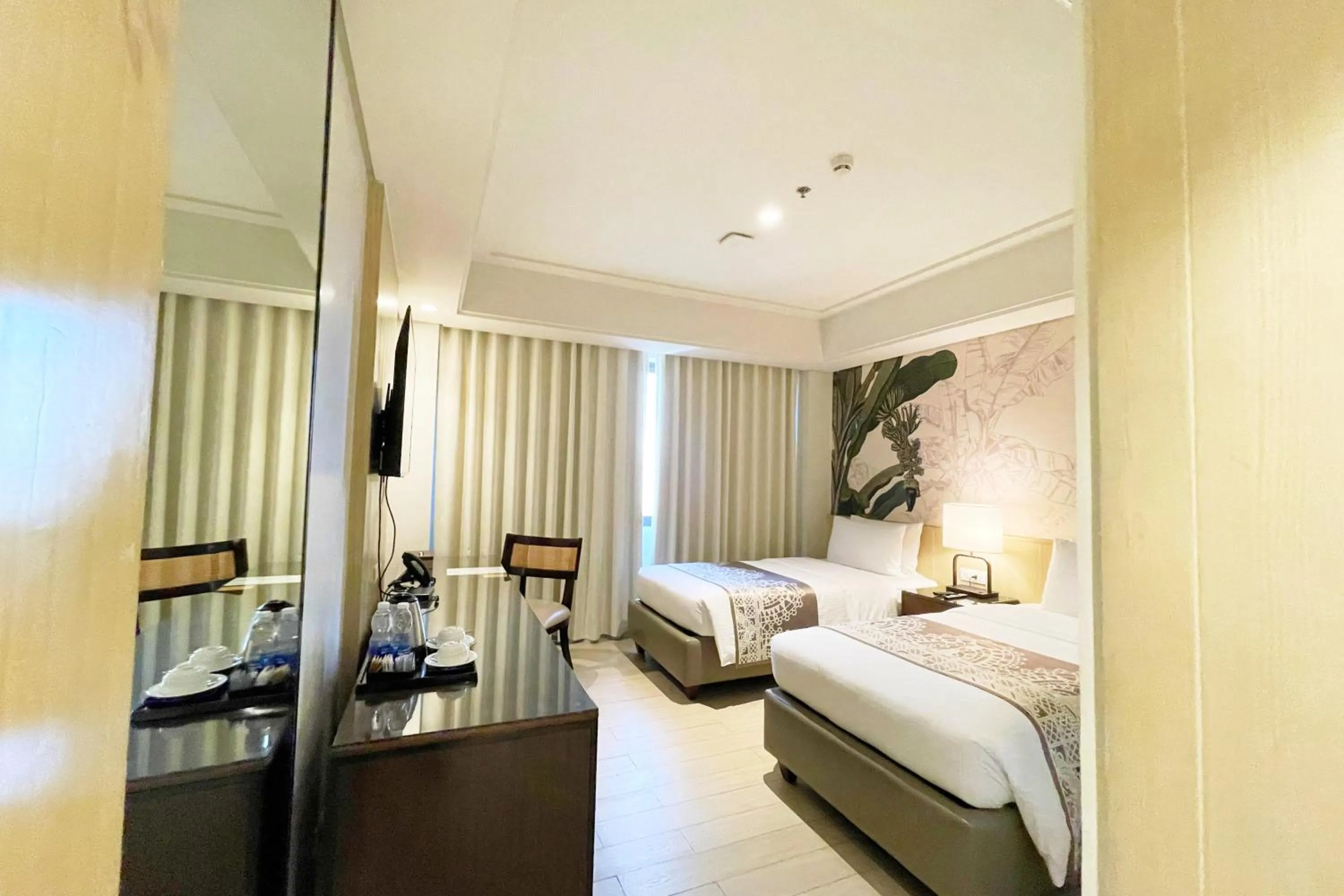 Bed in Mella Hotel Manila near NAIA Airport