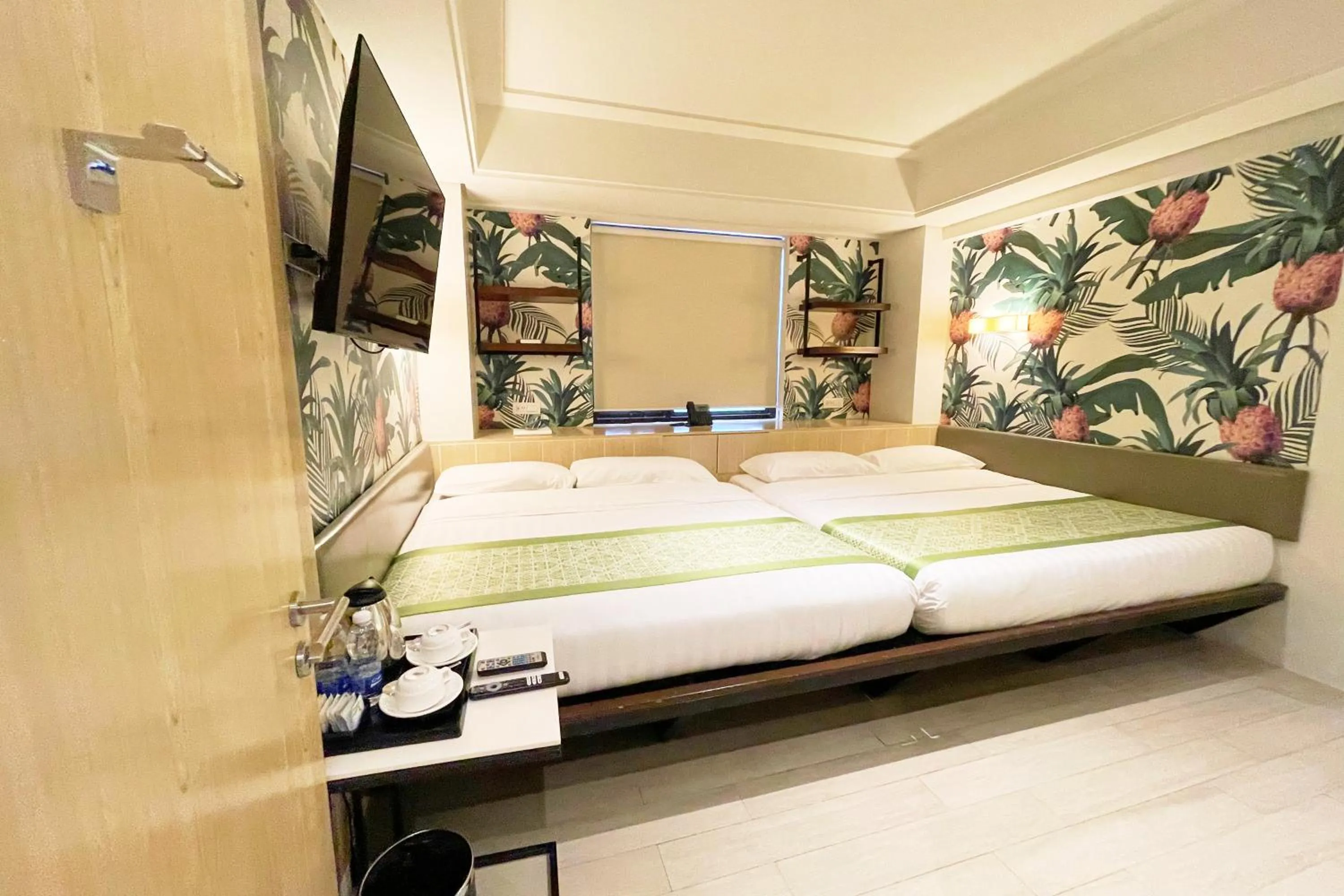 Bed in Mella Hotel Manila near NAIA Airport