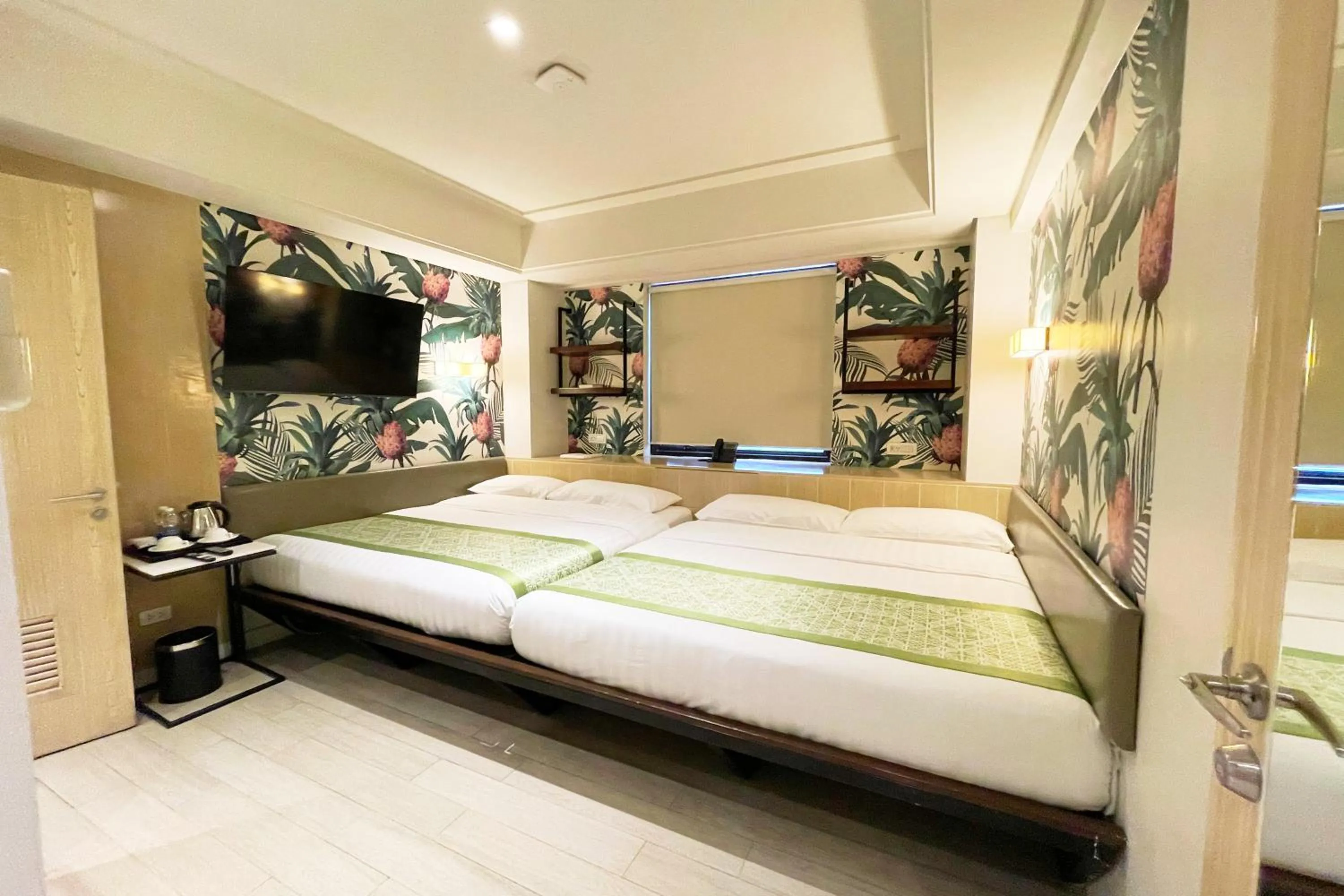 Bed in Mella Hotel Manila near NAIA Airport