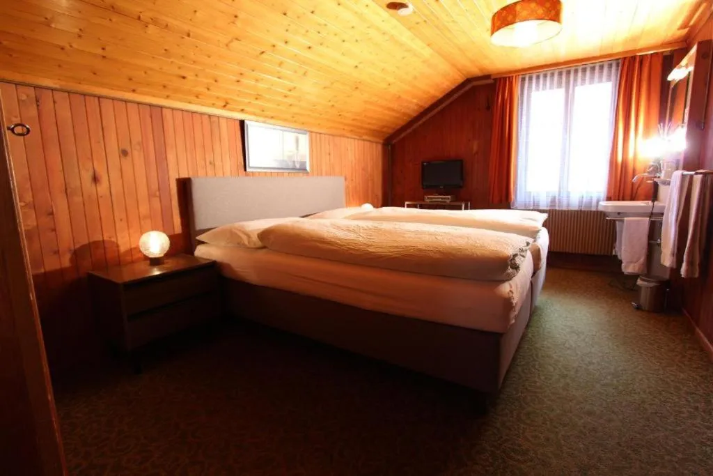 Bed in Hotel-Restaurant Alpina