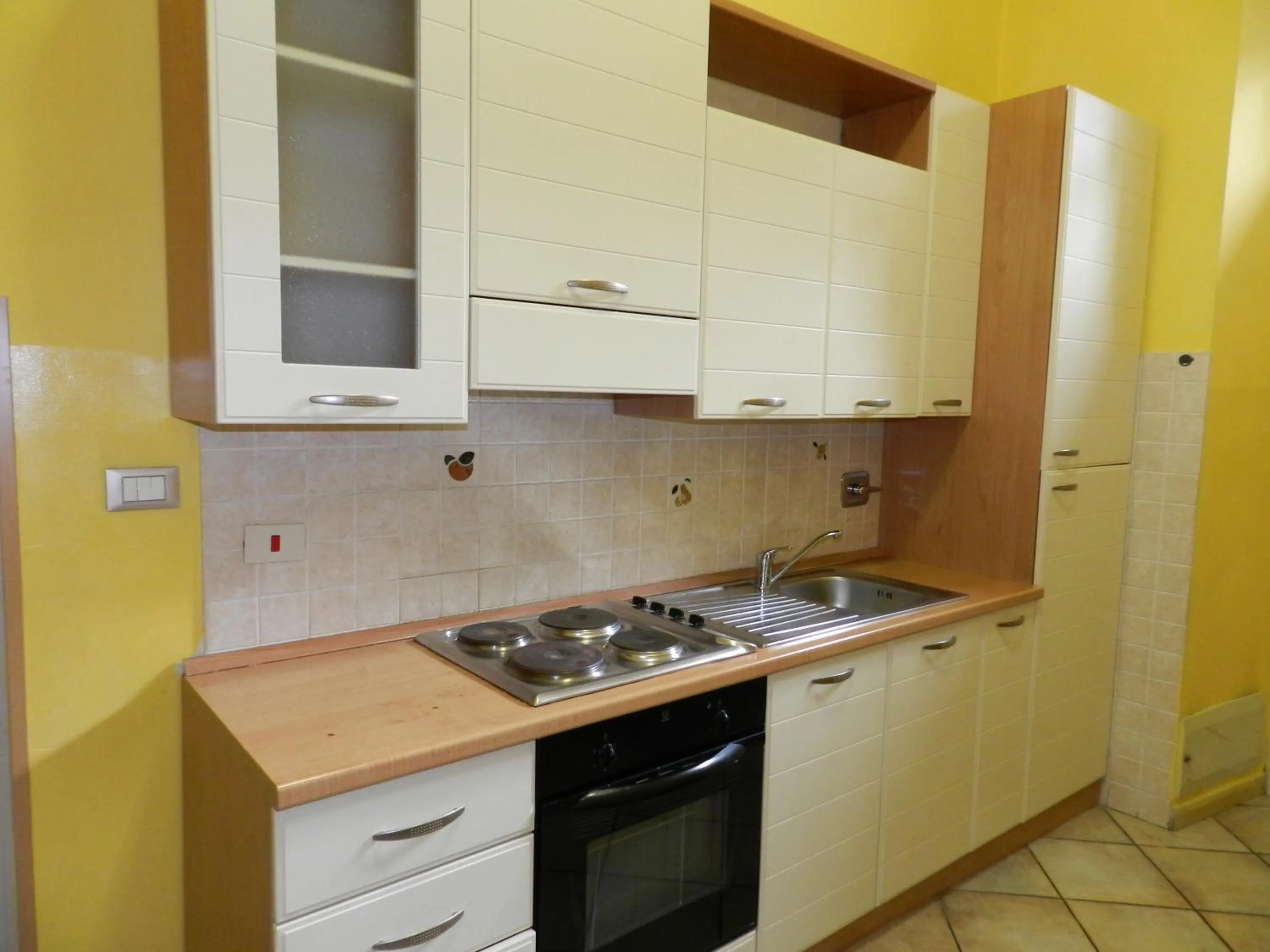 Kitchen or kitchenette in Appartamenti Valdocco