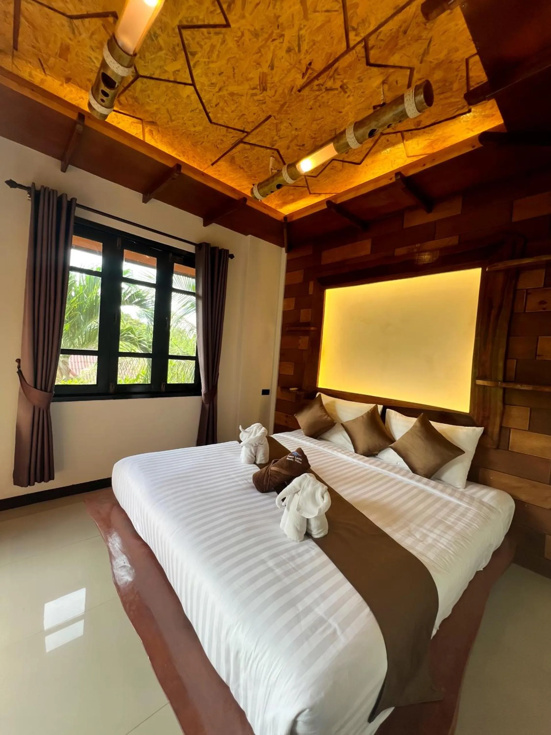 Bed in Puteri Lanta Family Villas