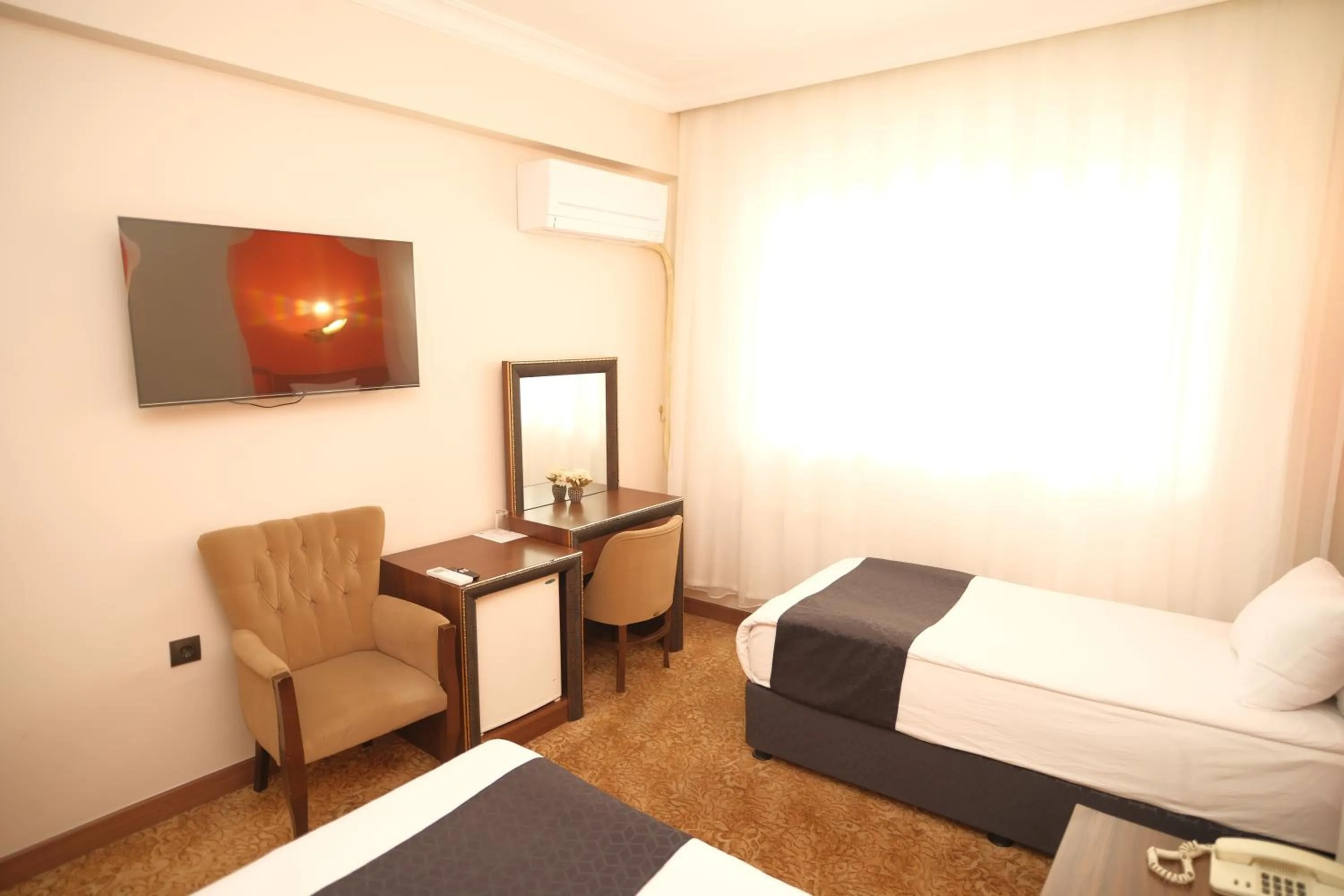 Seating area, Bed in Malabadi Hotel