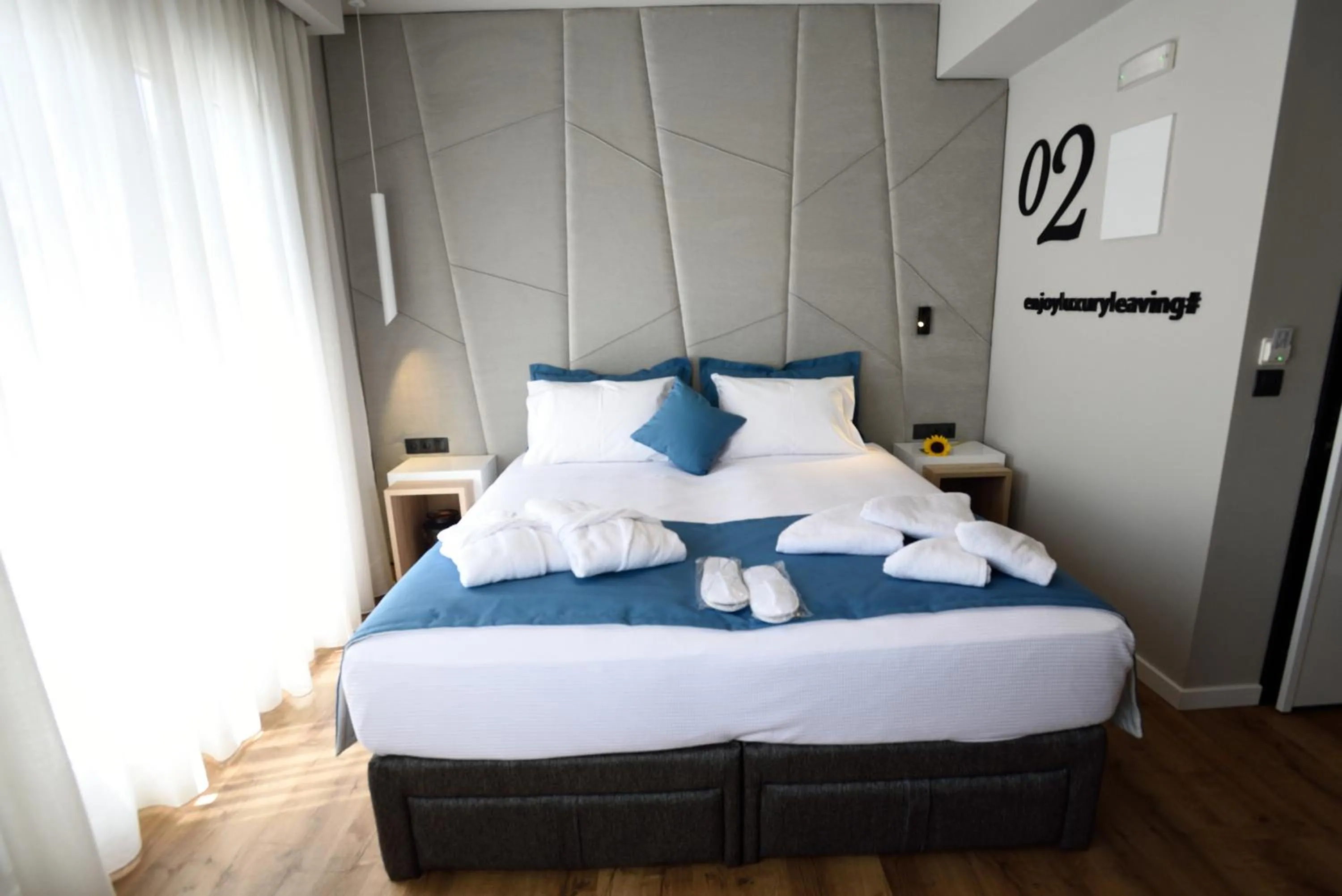 Bed in Magnifique Luxury Suites