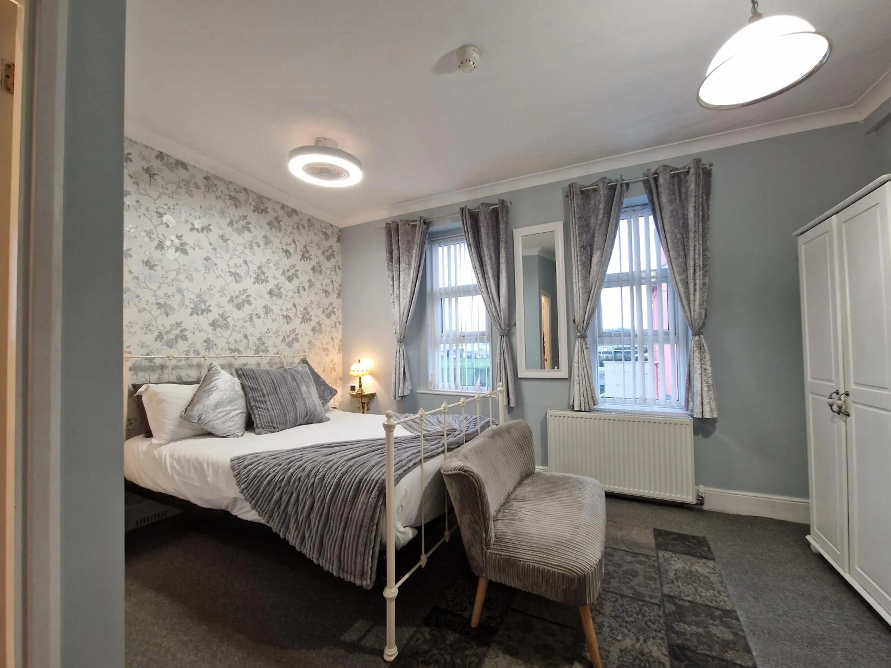 Bed in Ambassador Guest House