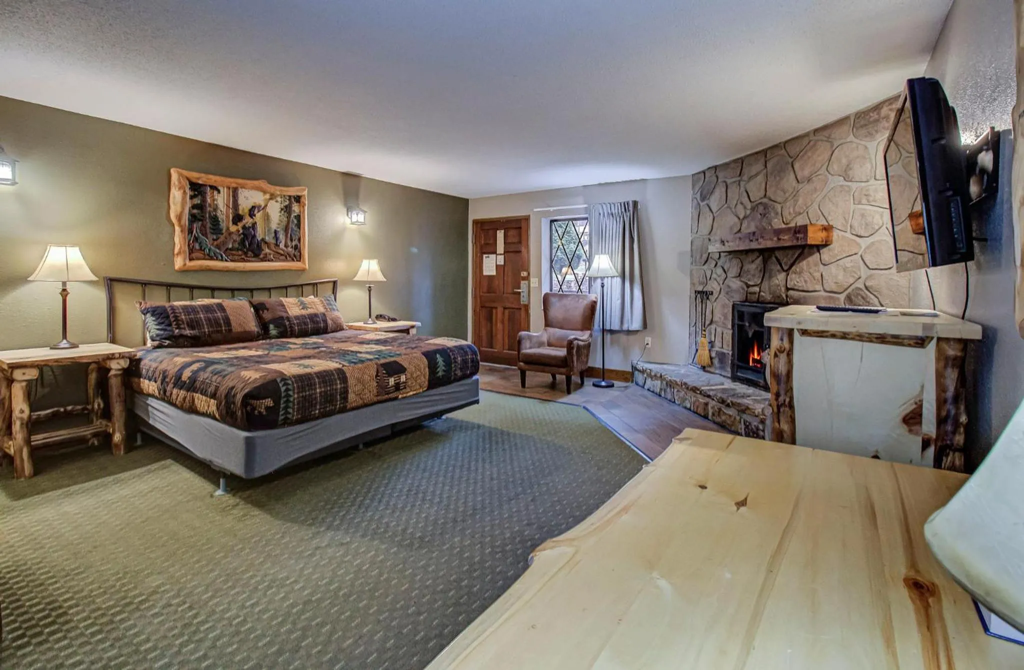 fireplace, Bed in Brookside Lodge