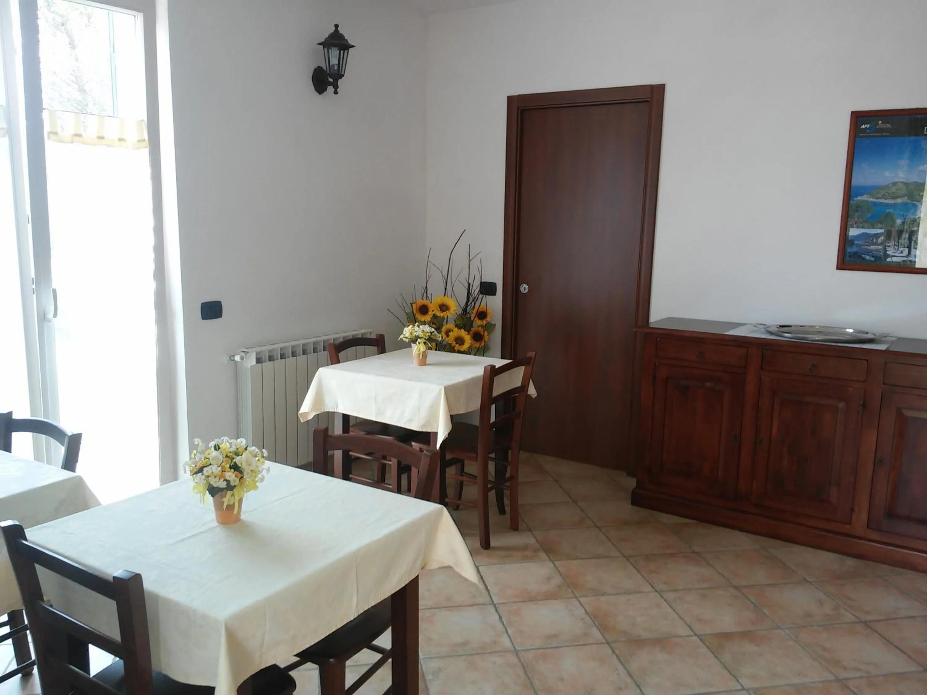 Communal lounge/ TV room in B&B Oasi Verde