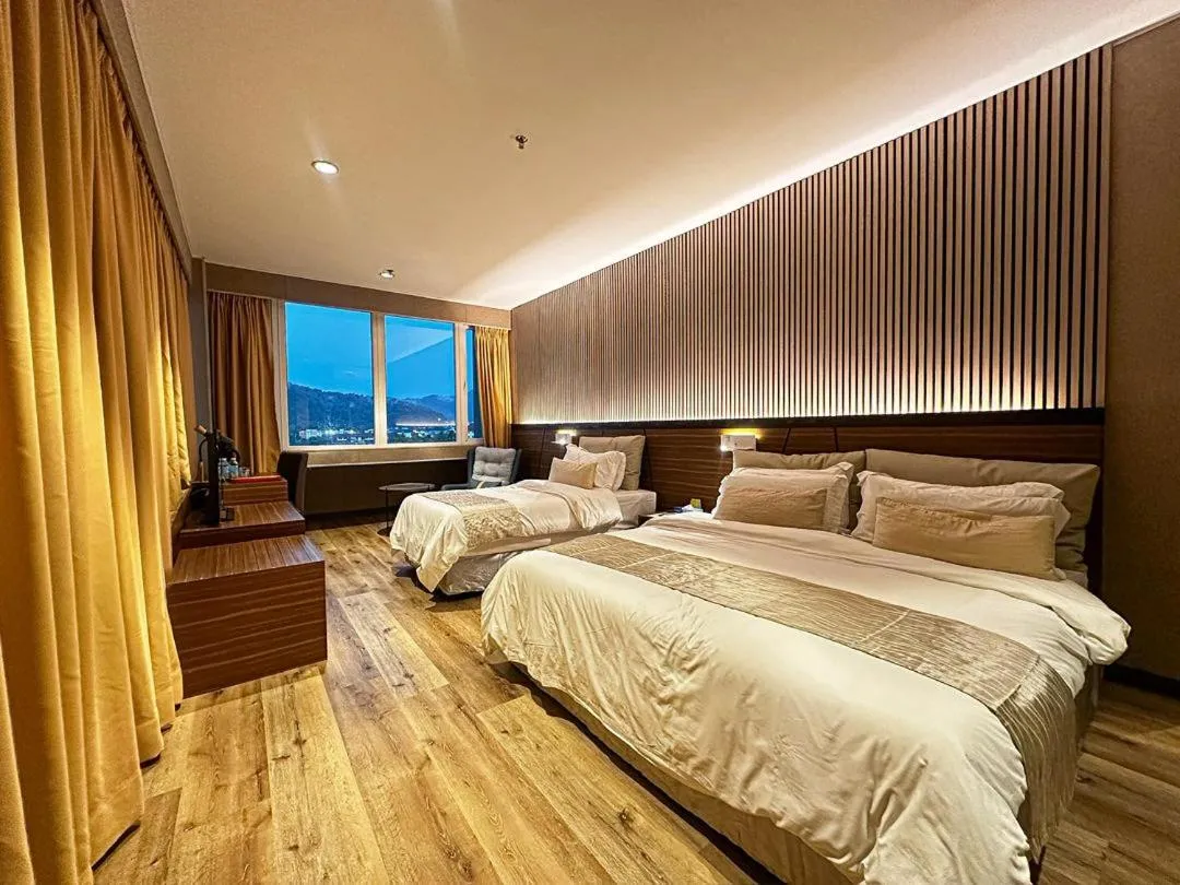 Bed in Pine Tree Hotel