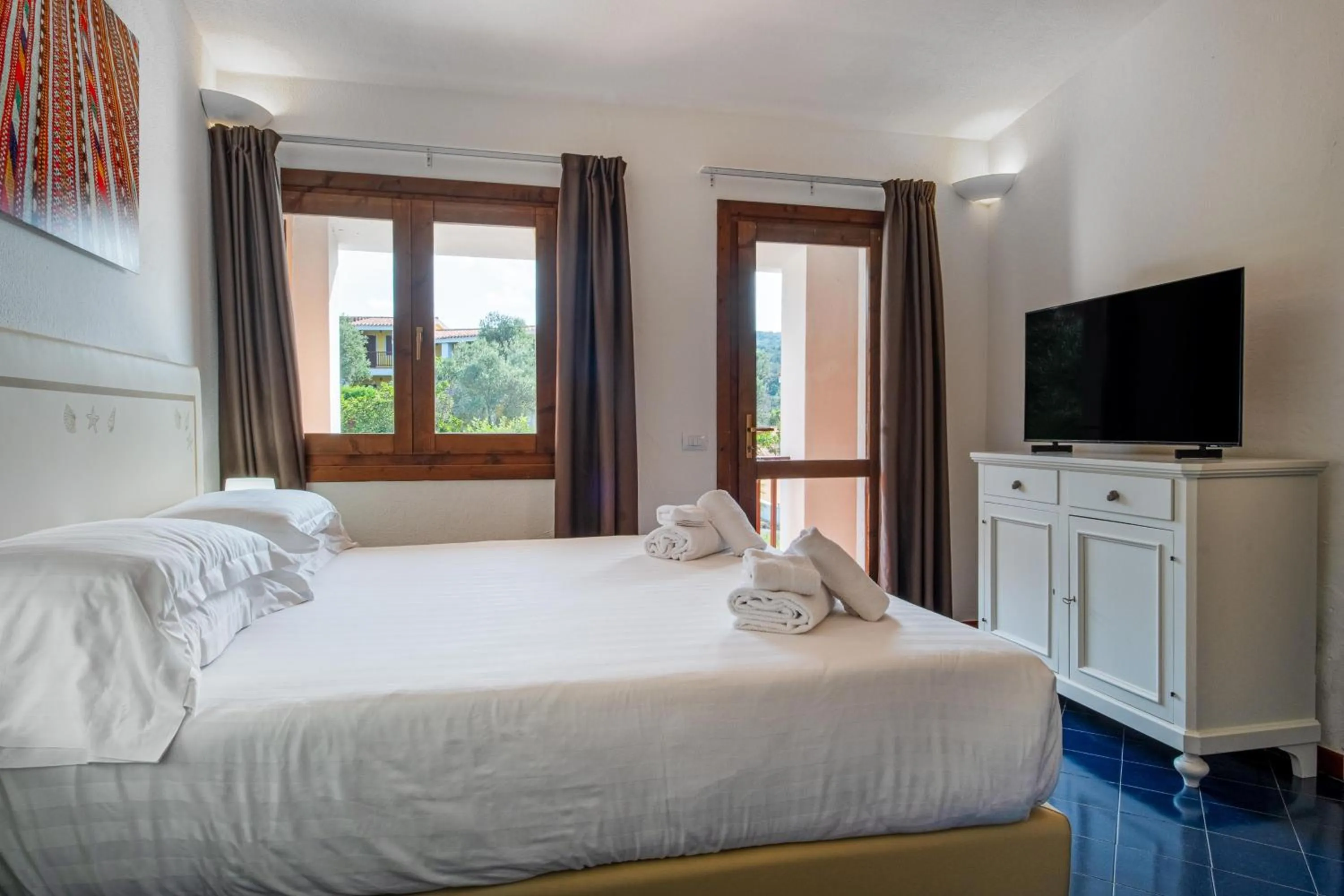 Bed in Felix Hotels - Residence Hotel Costa Serena