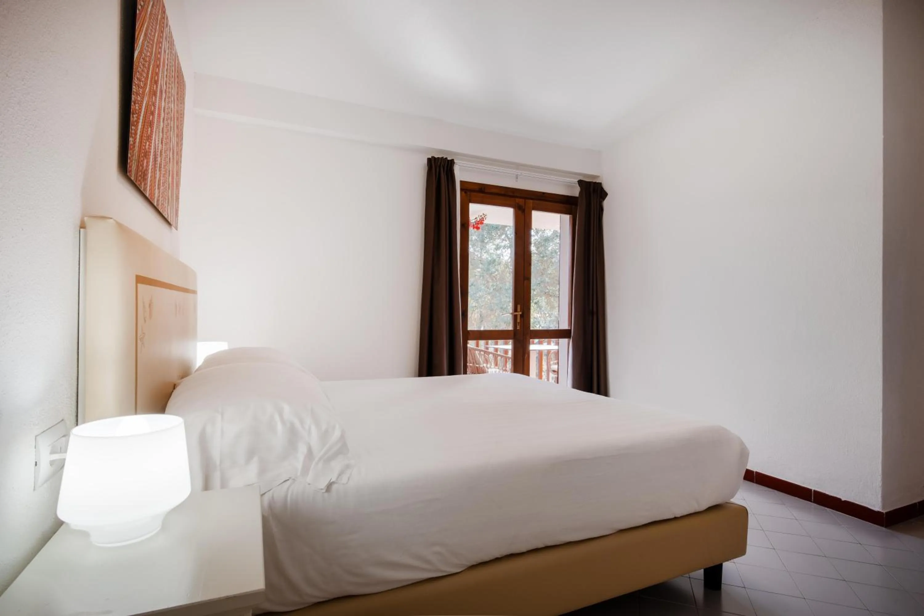 Bed in Felix Hotels - Residence Hotel Costa Serena