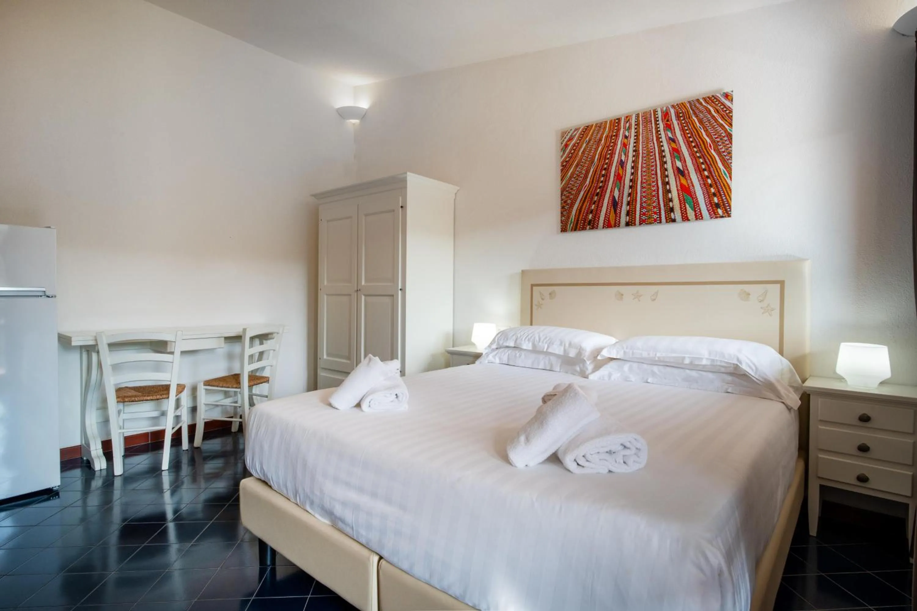 Bed in Felix Hotels - Residence Hotel Costa Serena