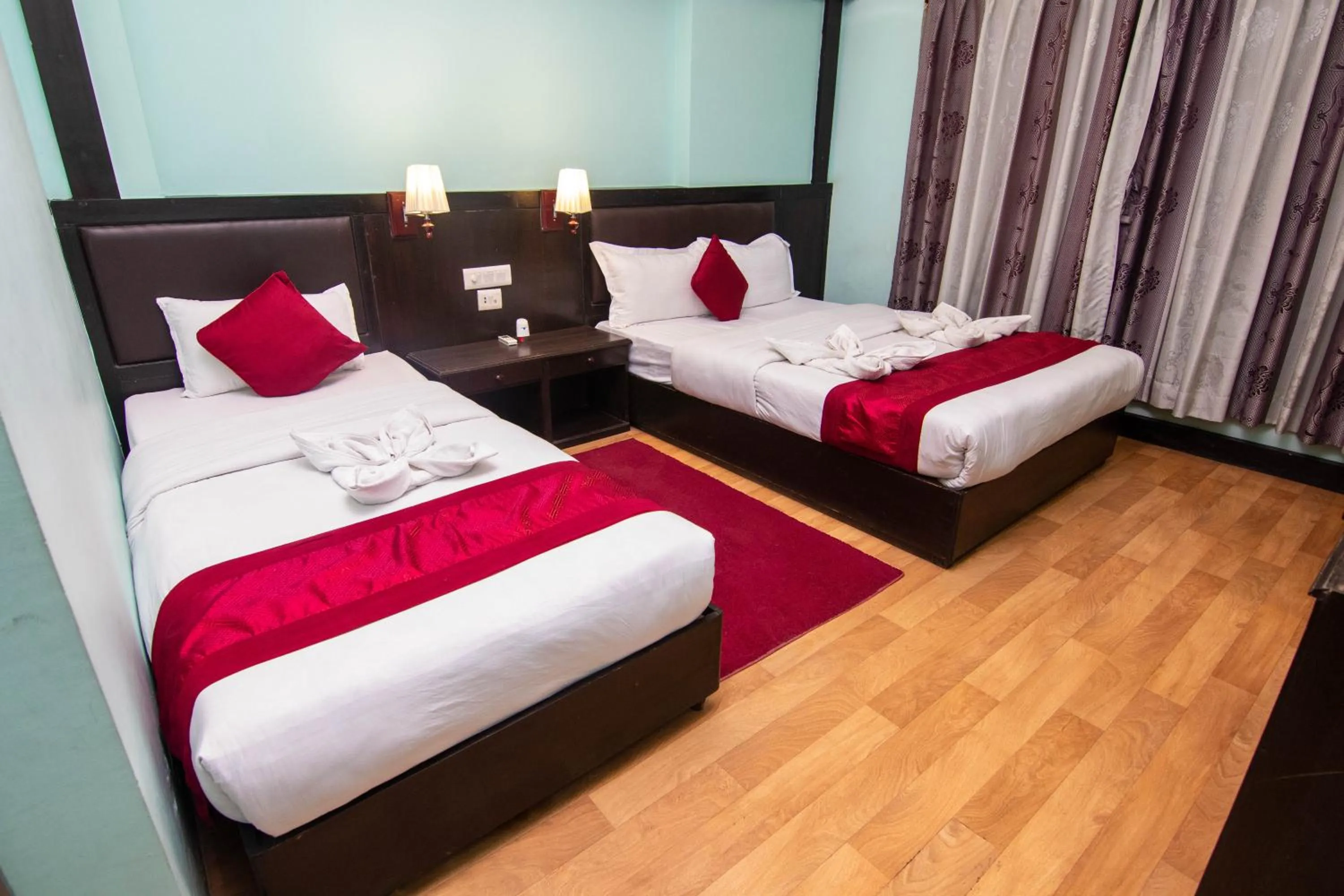 Bed in Hotel Ananda Inn