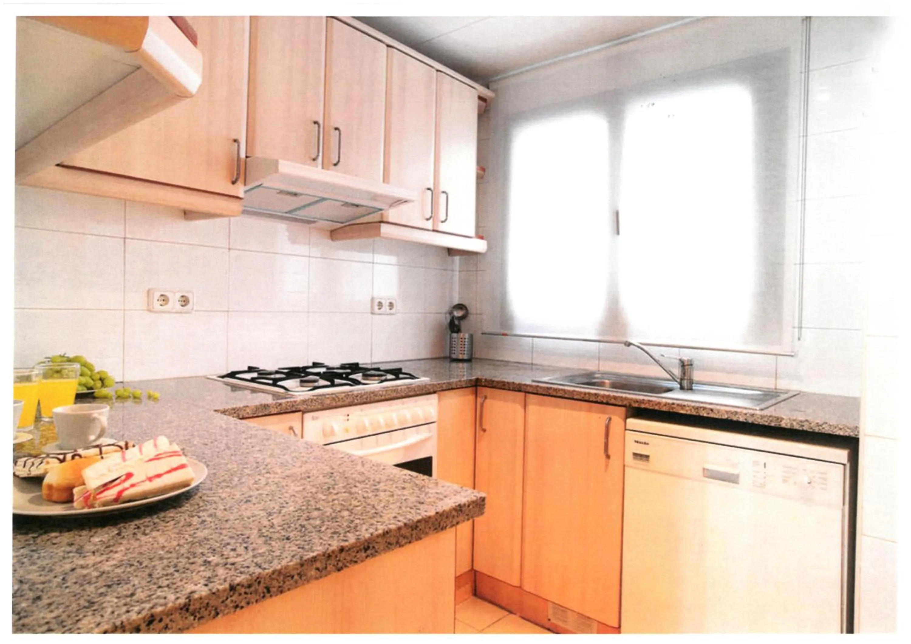 Kitchen or kitchenette in Serennia Apartamentos Ramblas - Plaça Catalunya