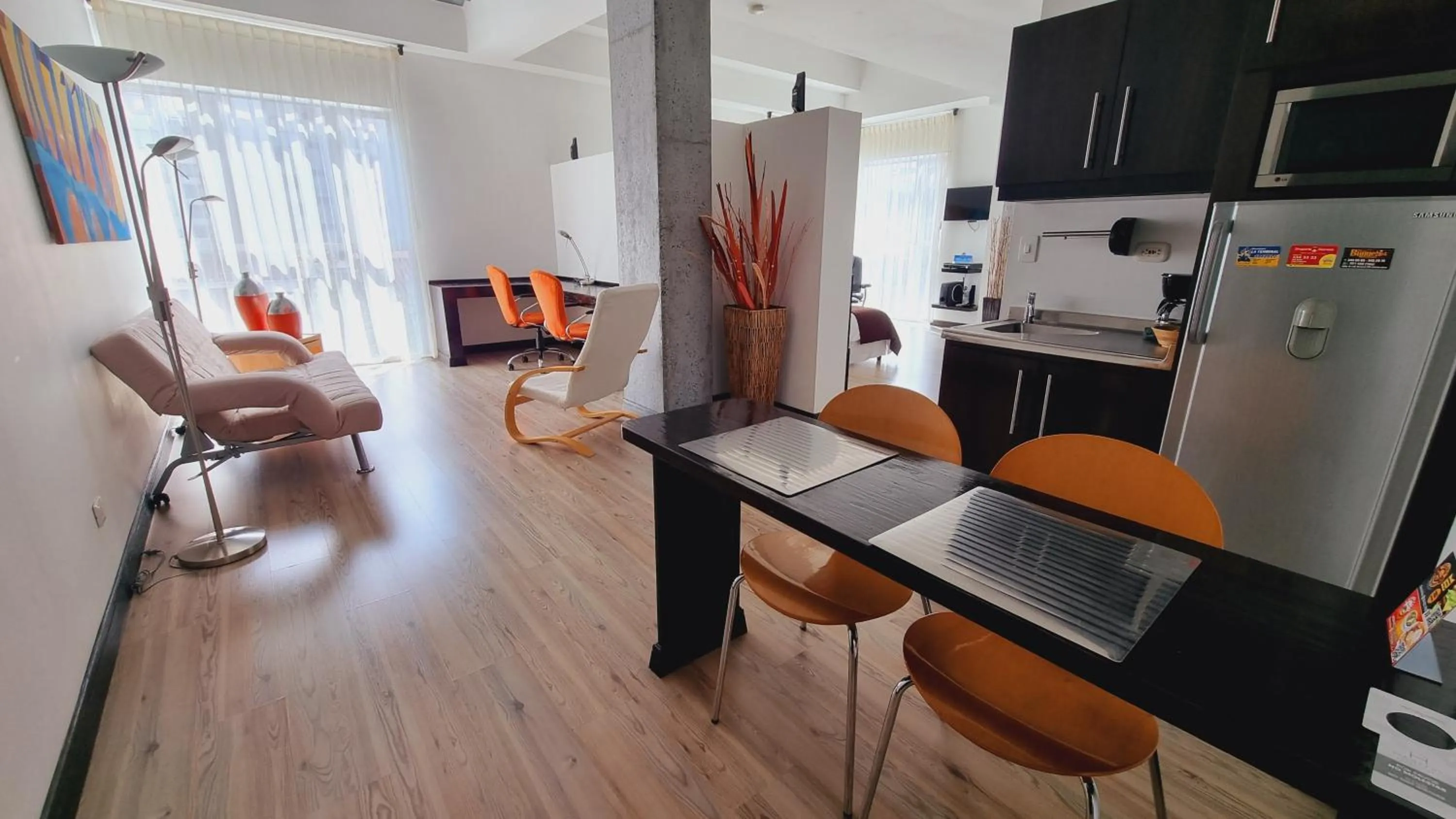 Living room in Habitat Suites Hotel By GHO Hoteles