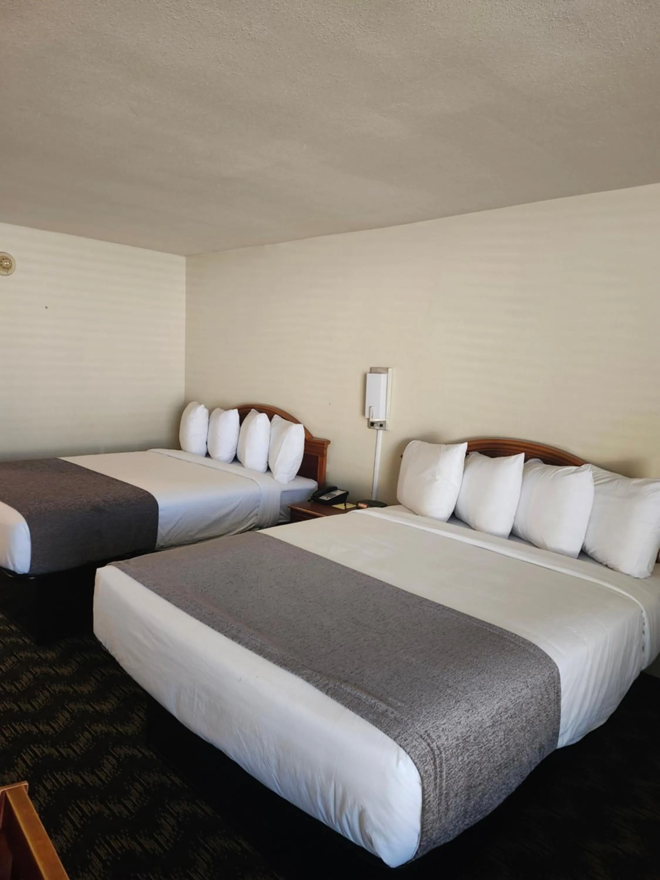 Bed in The Inn and Suites at 34 Fifty