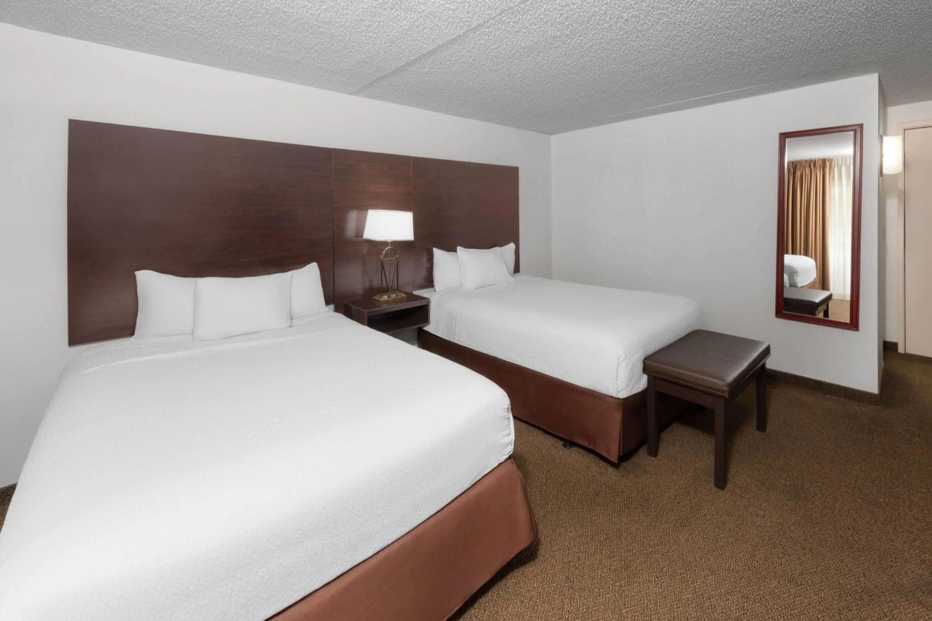 Photo of the whole room, Bed in Endeavor Inn & Suites, Trademark Collection by Wyndham
