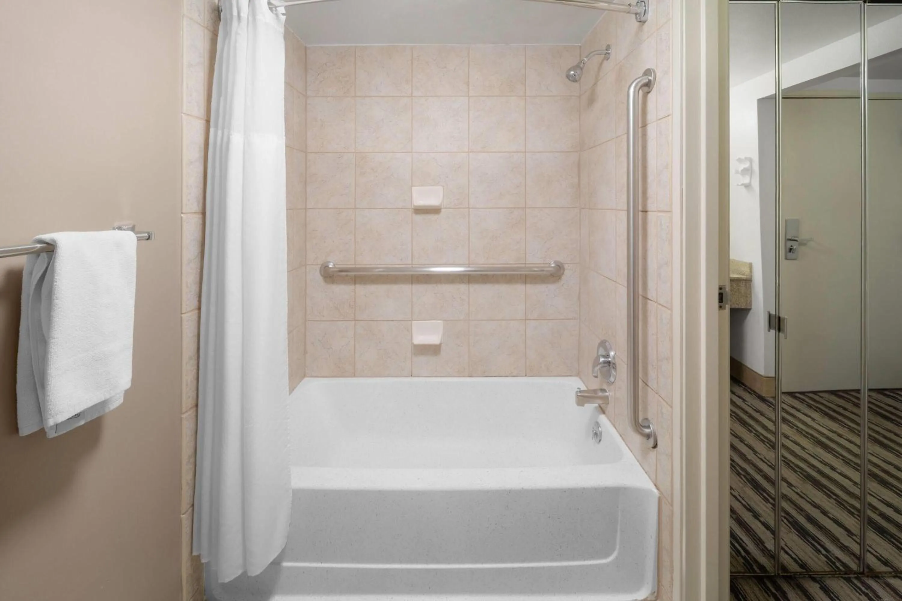 Bathroom in Endeavor Inn & Suites, Trademark Collection by Wyndham