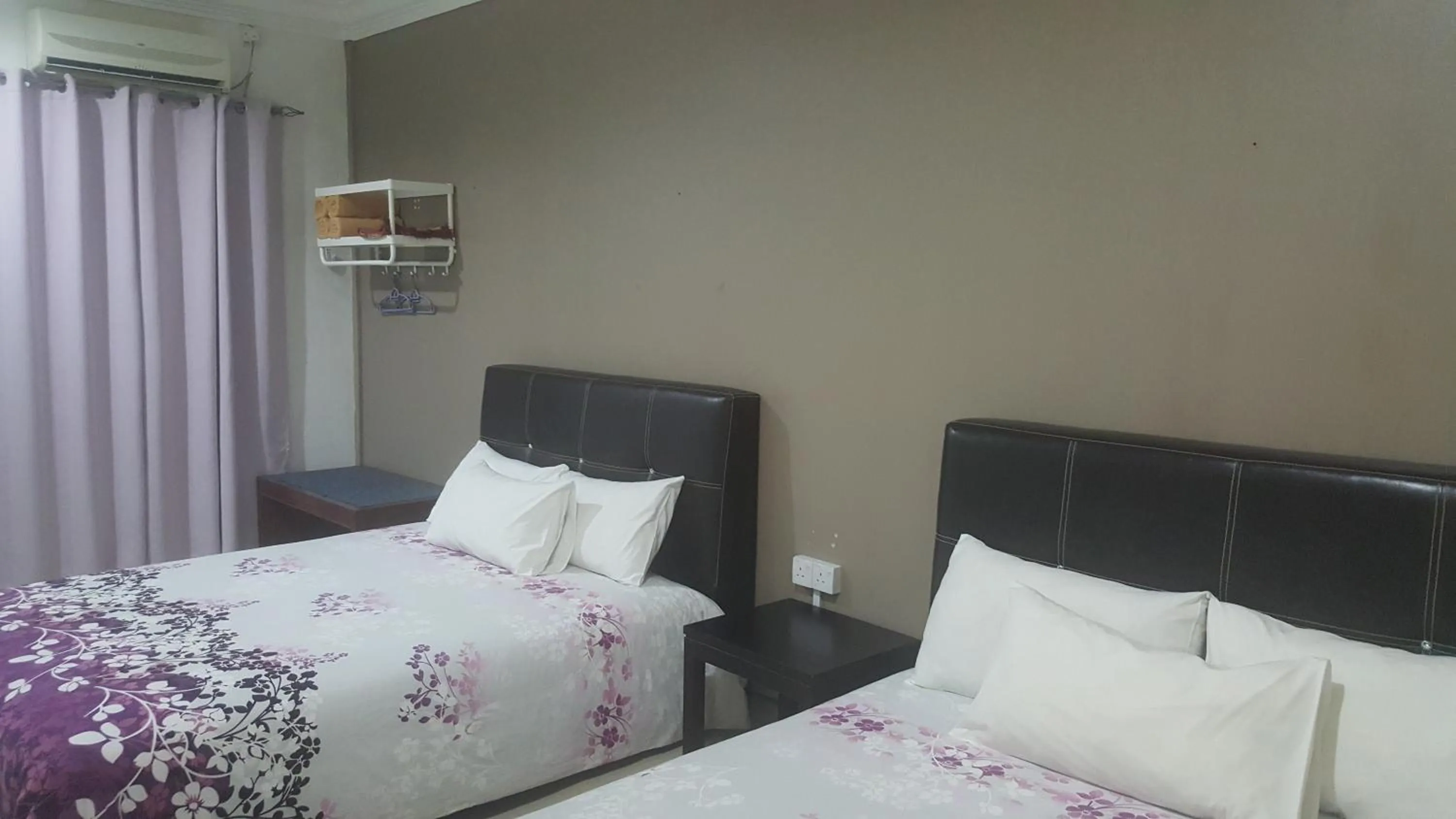 Bed in HOTEL SHAFURA 1