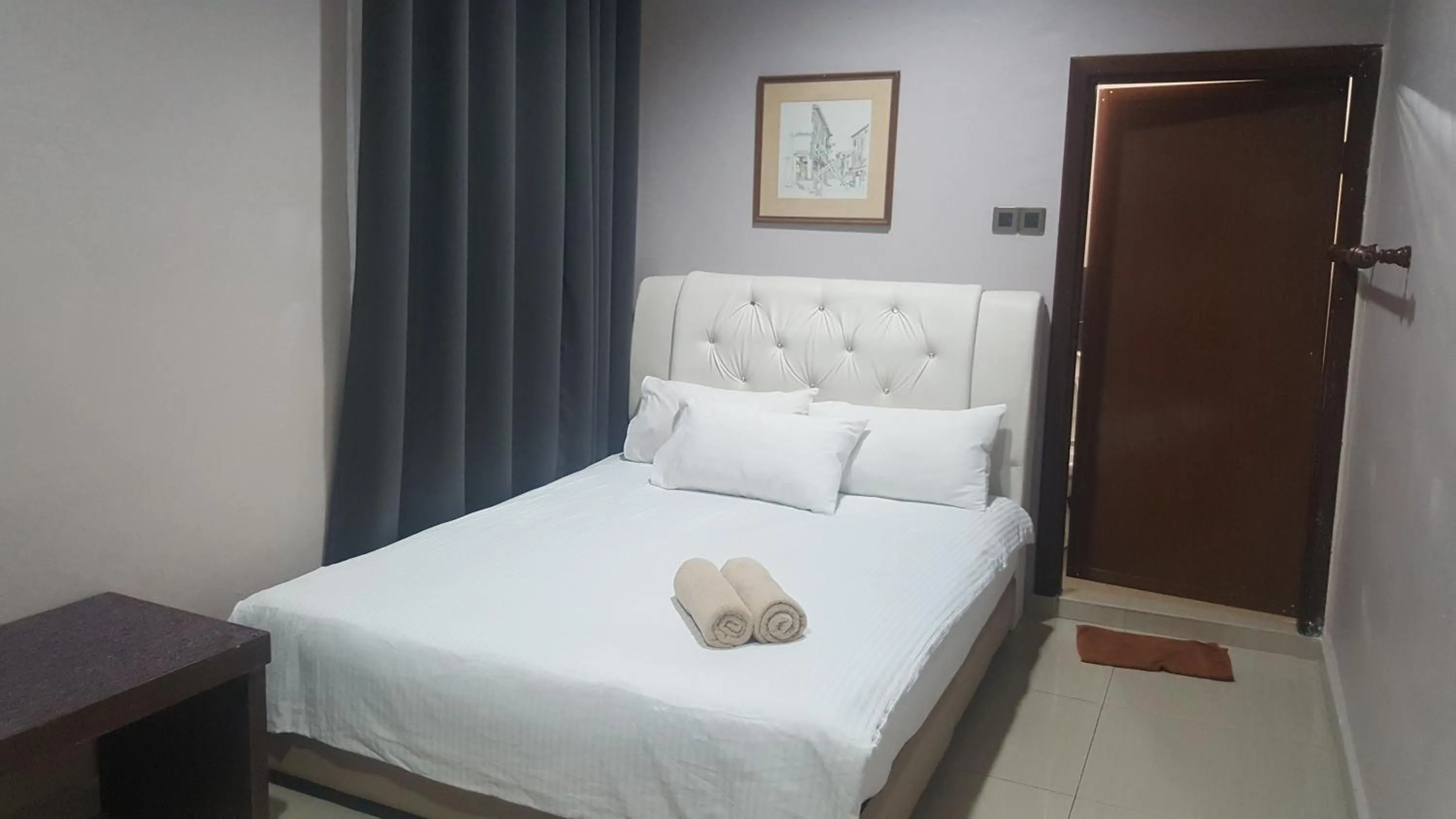 Bed in HOTEL SHAFURA 1