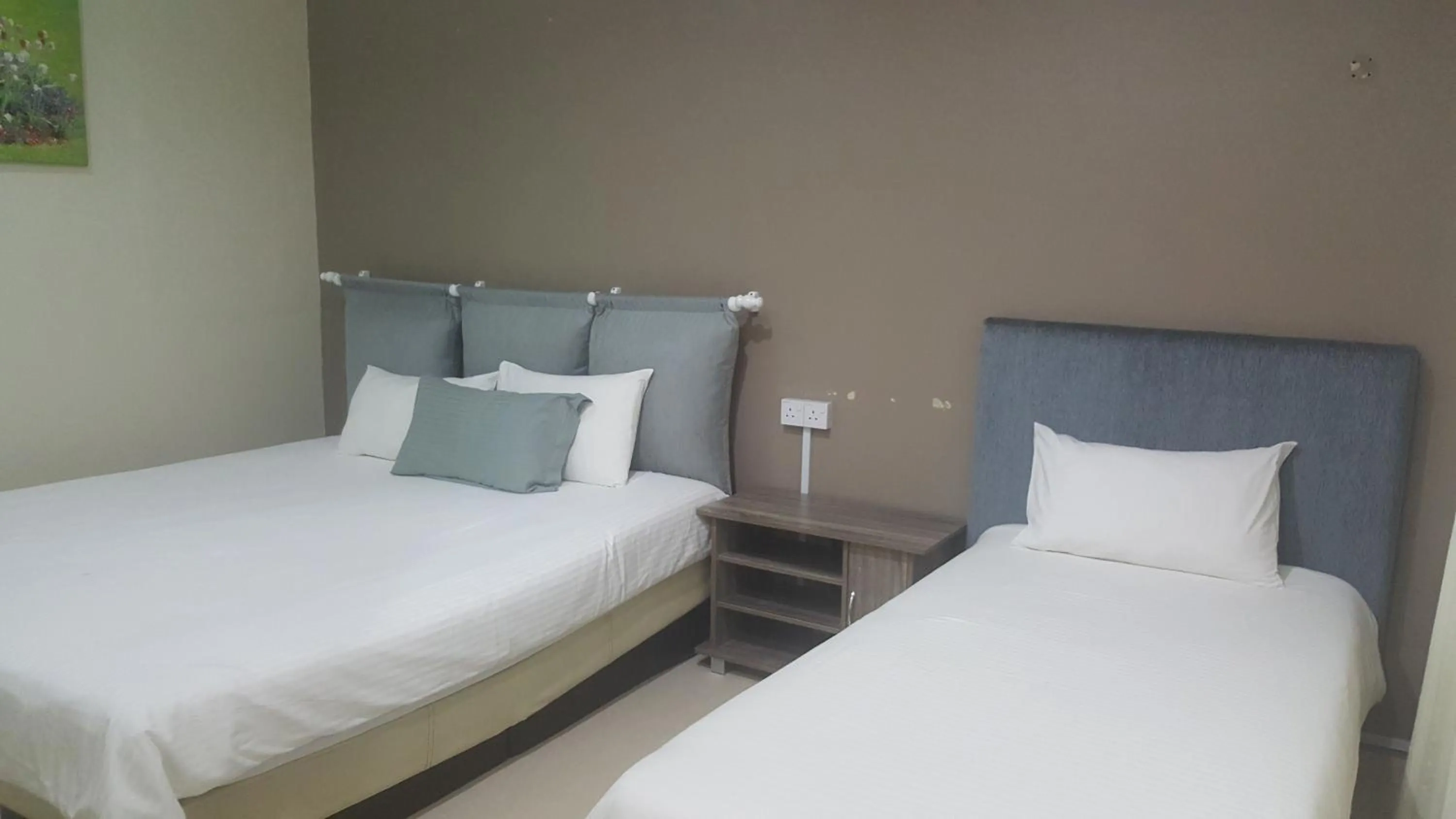 Bed in HOTEL SHAFURA 1