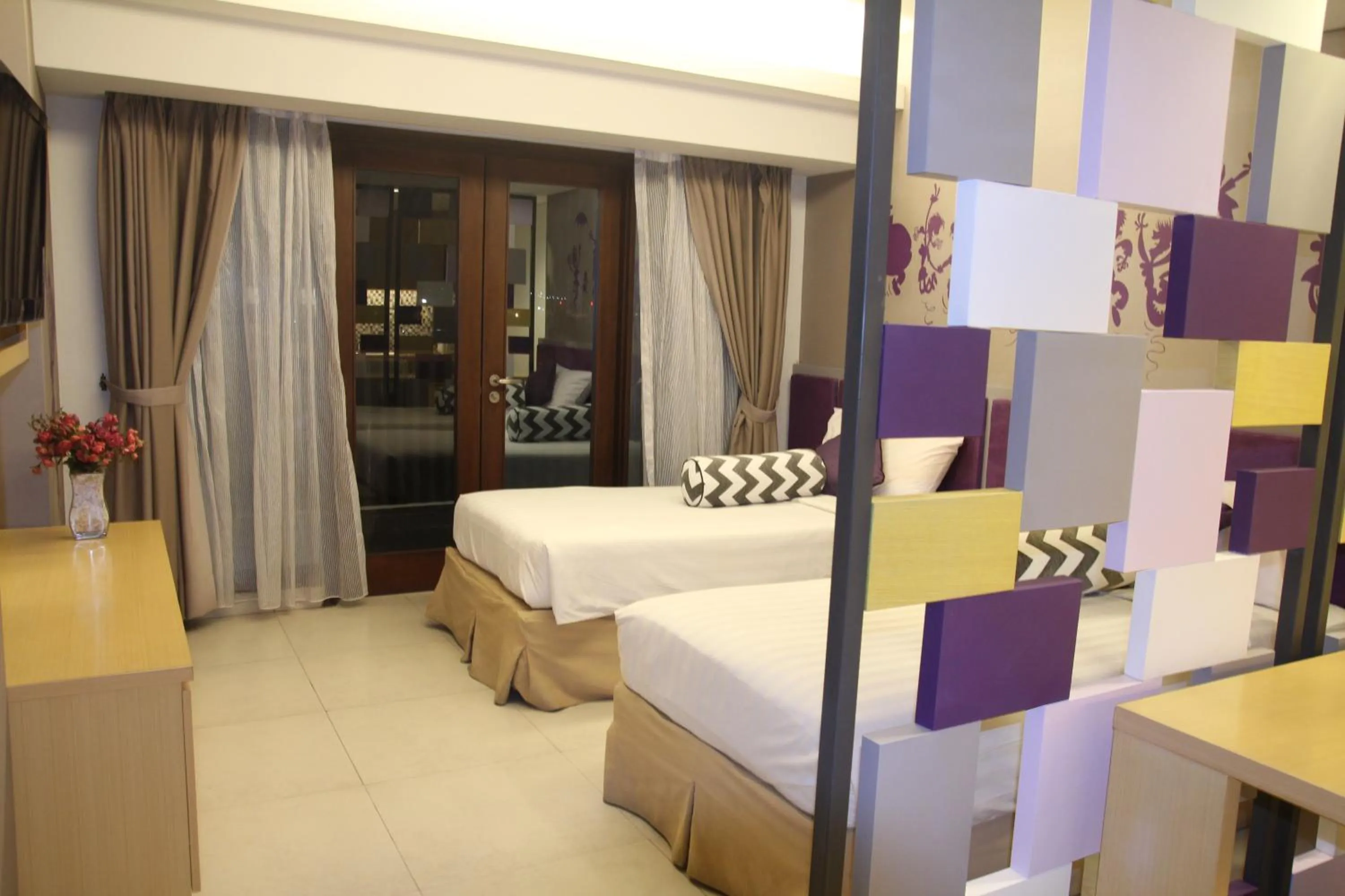 Bedroom, Bed in Quest Hotel Kuta by ASTON