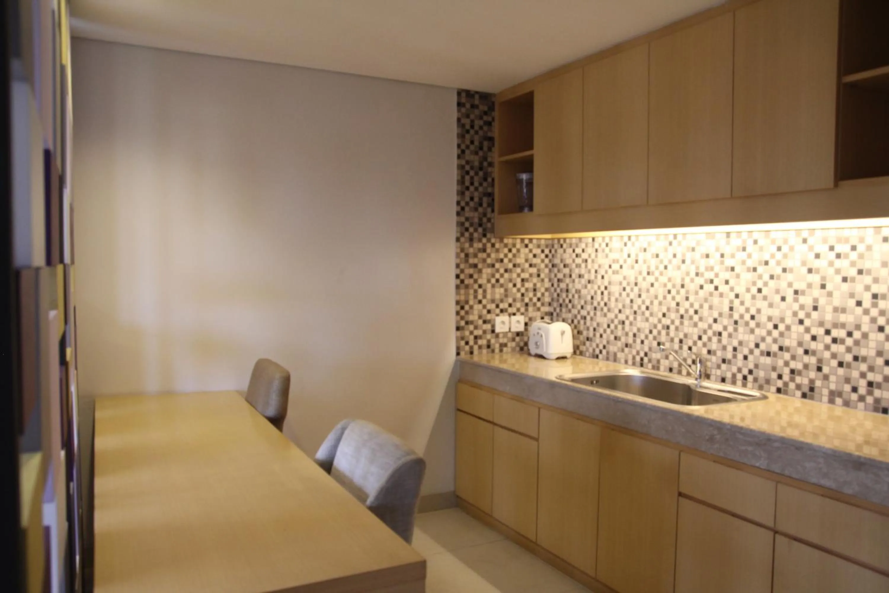 Bedroom in Quest Hotel Kuta by ASTON