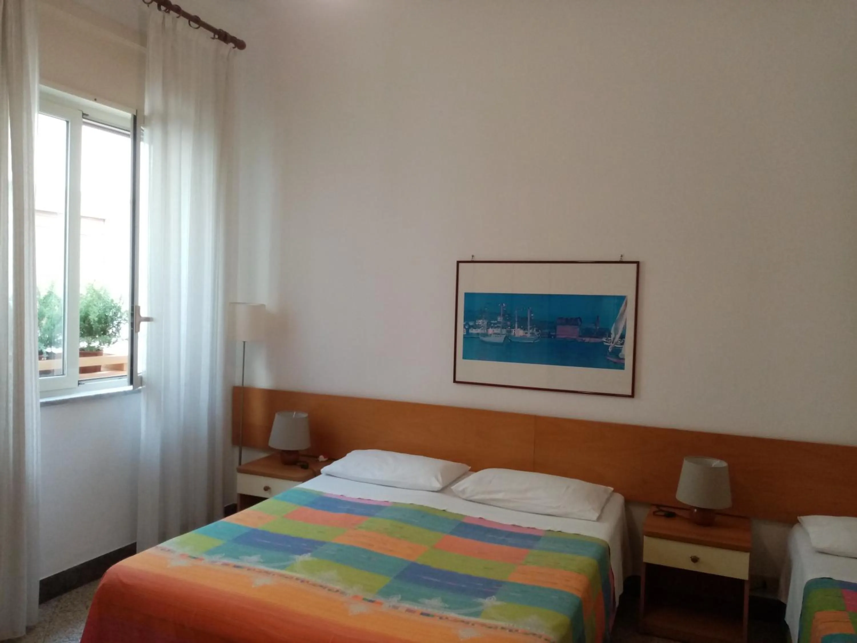 Bed in Ariston Petit Hotel