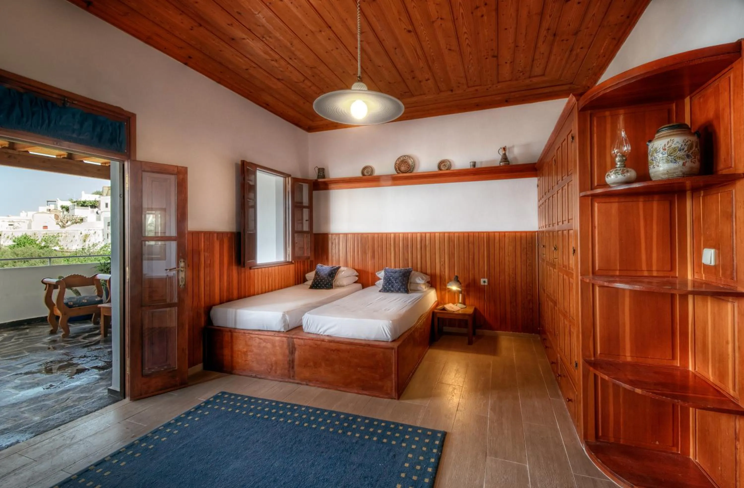 Bed in Thea Villas and Suite