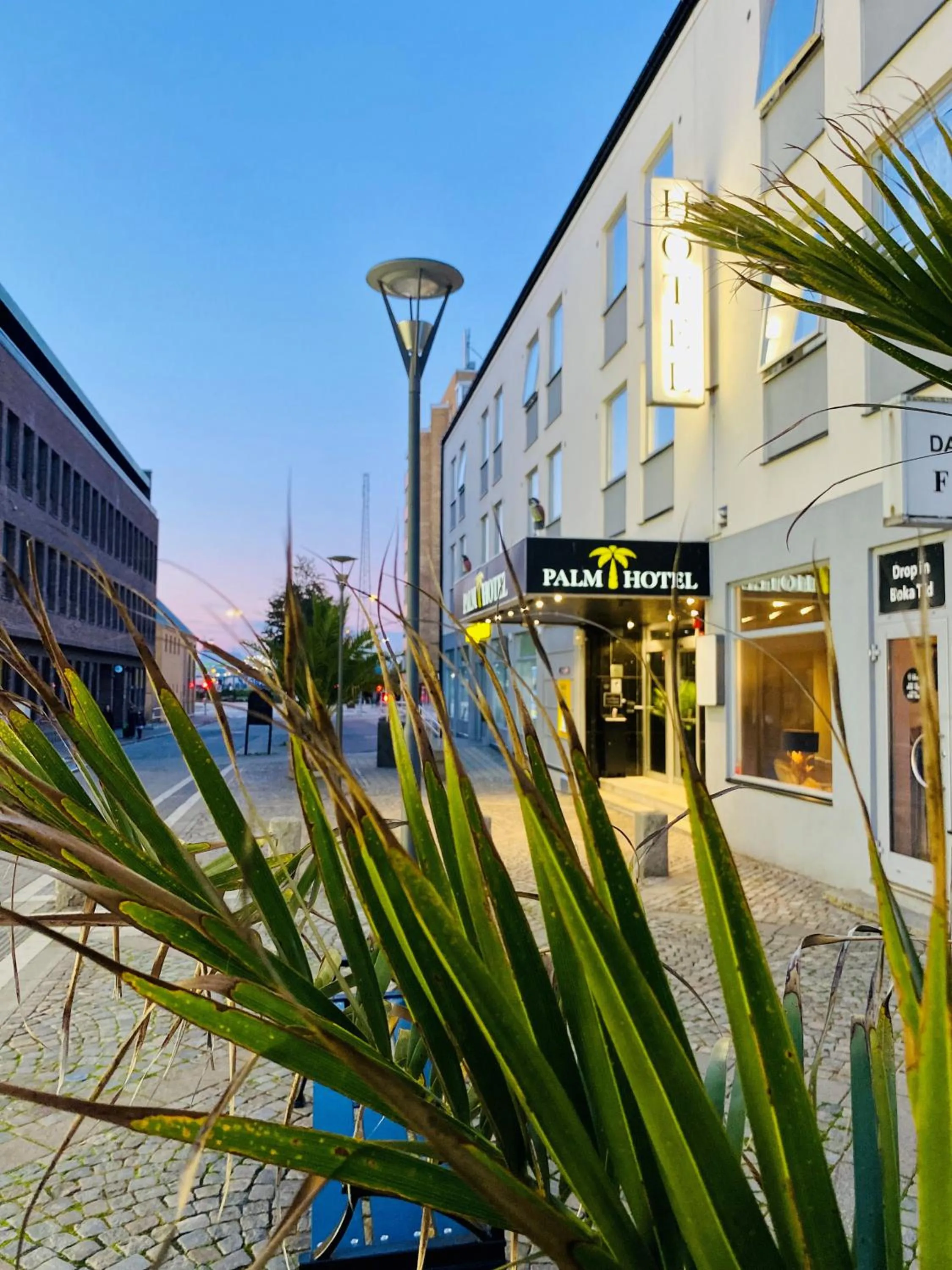 Property building in Palm Tree Hotel, Best Western Signature Collection