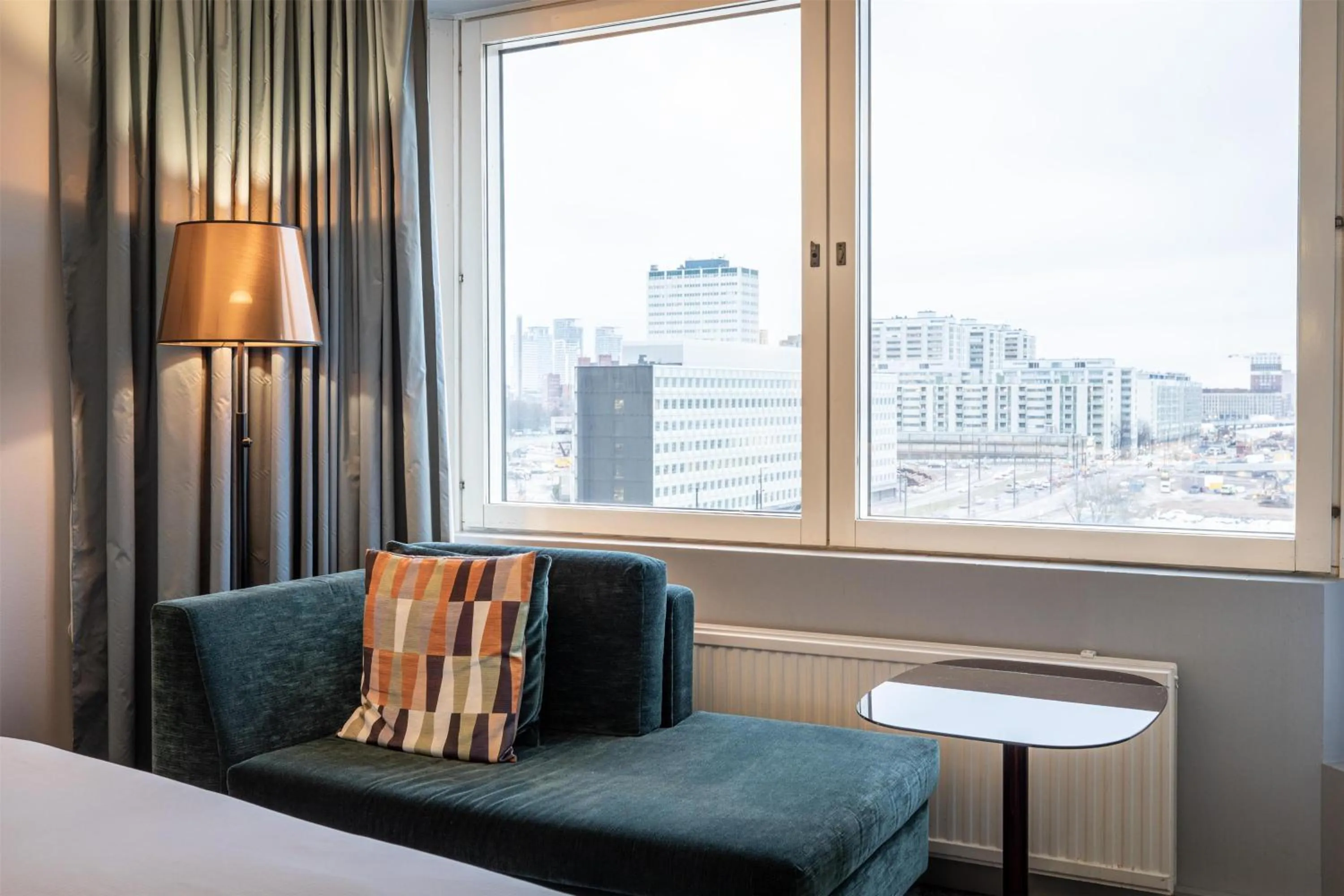 Living room, Bed in Hilton Helsinki Strand