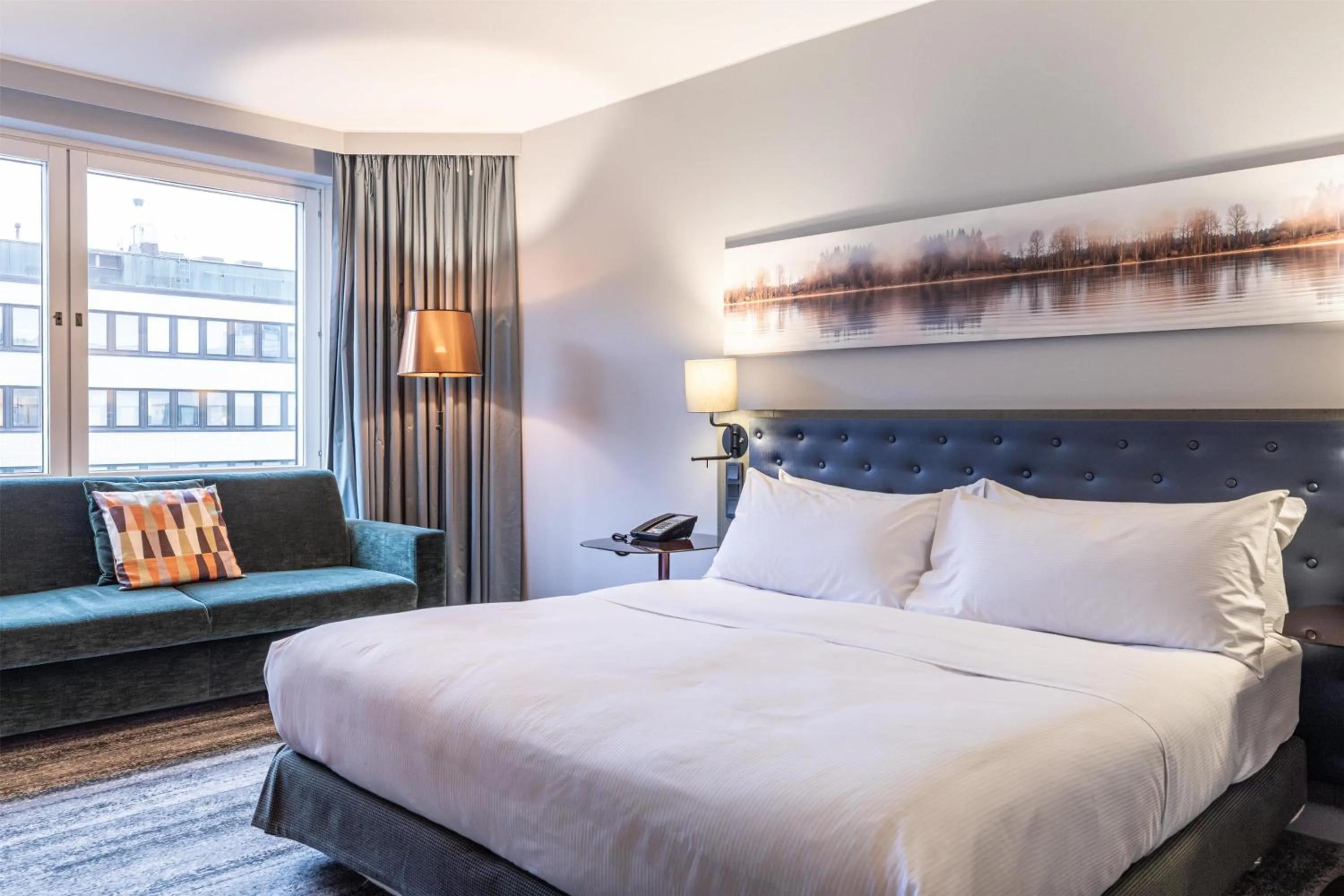 Living room, Bed in Hilton Helsinki Strand