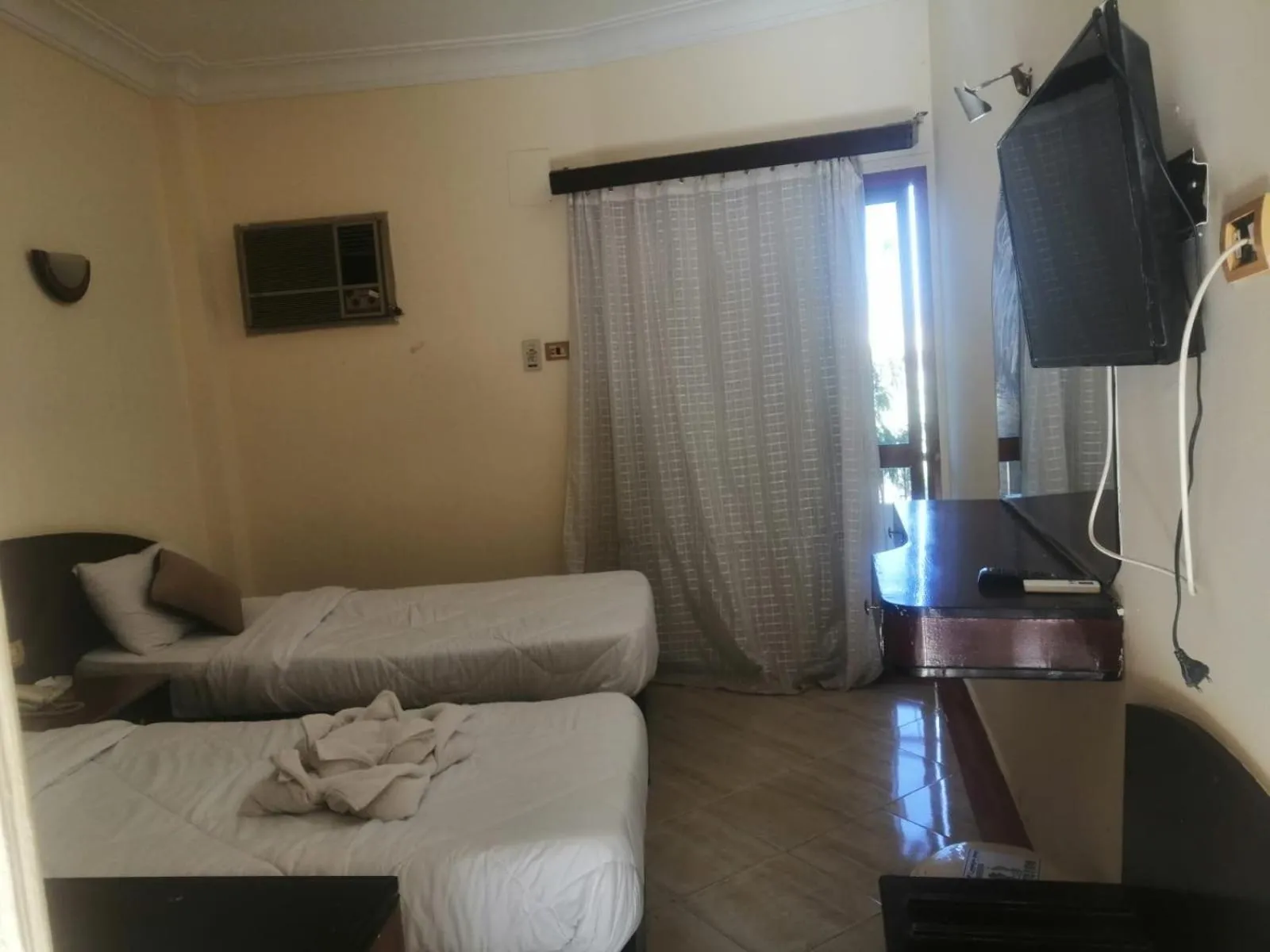 Communal lounge/ TV room, Bed in Eiffel Hotel Hurghada