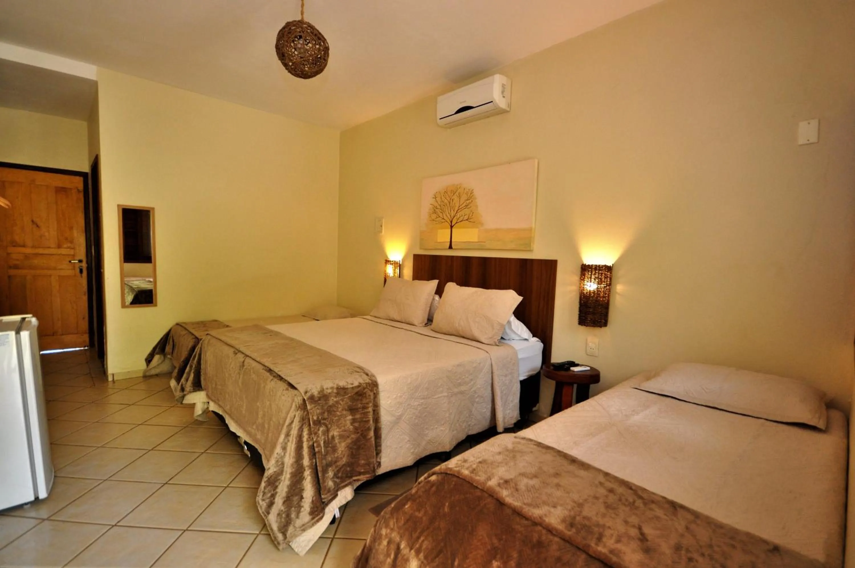 Bed in Pousada Flores do Cerrado