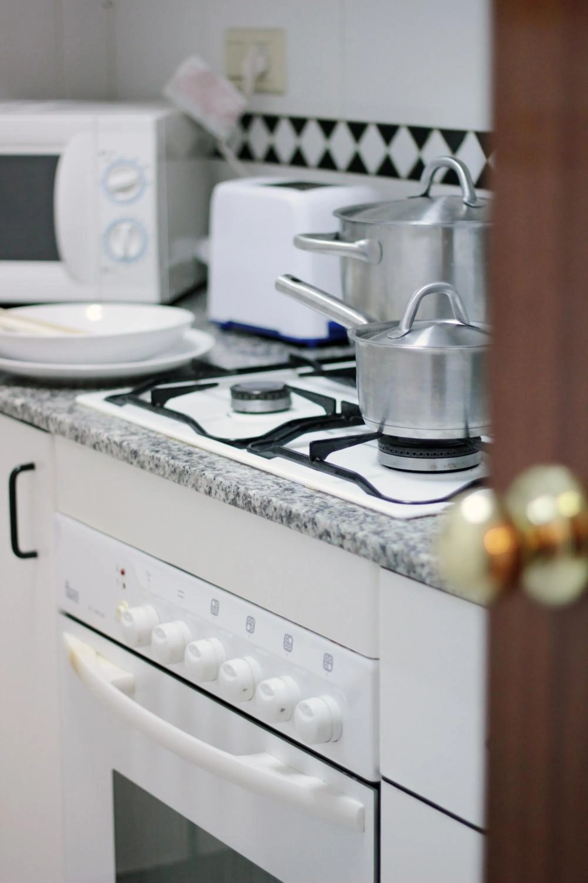 Kitchen or kitchenette in Alguera Apartments Napols