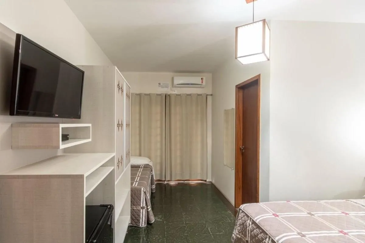 Photo of the whole room, Bed in Pousada Cores do Mar | Conforto com Piscina em Bombinhas