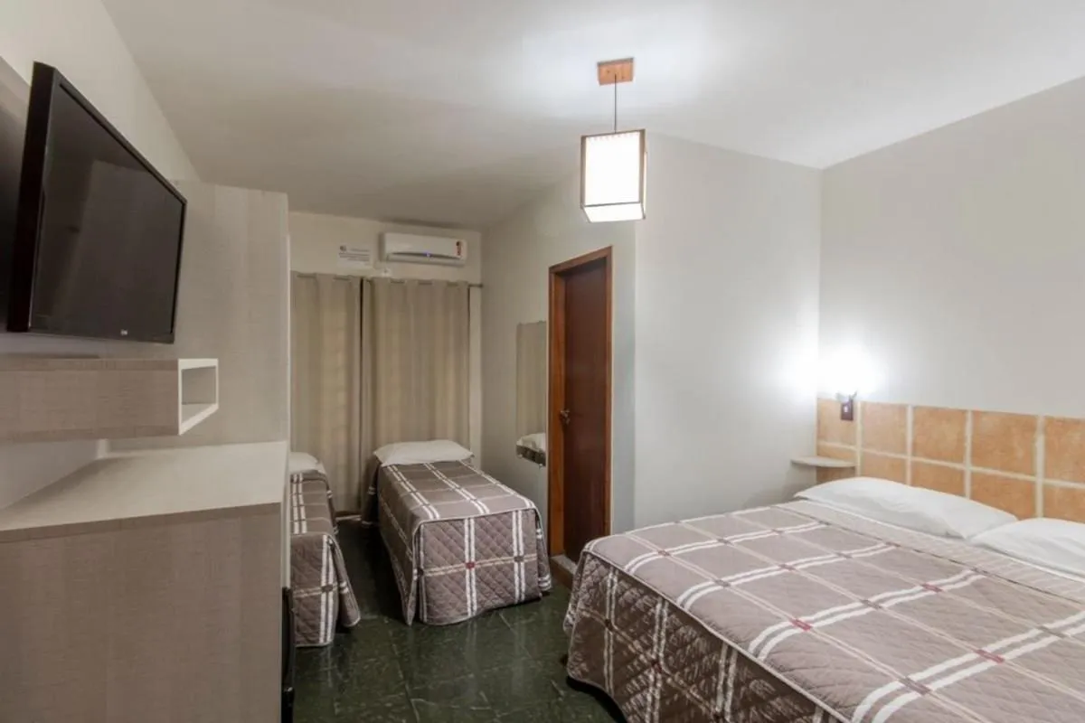 Photo of the whole room, Bed in Pousada Cores do Mar | Conforto com Piscina em Bombinhas