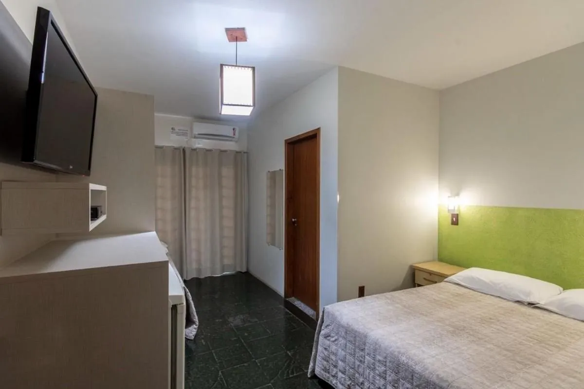 Photo of the whole room, Bed in Pousada Cores do Mar | Conforto com Piscina em Bombinhas