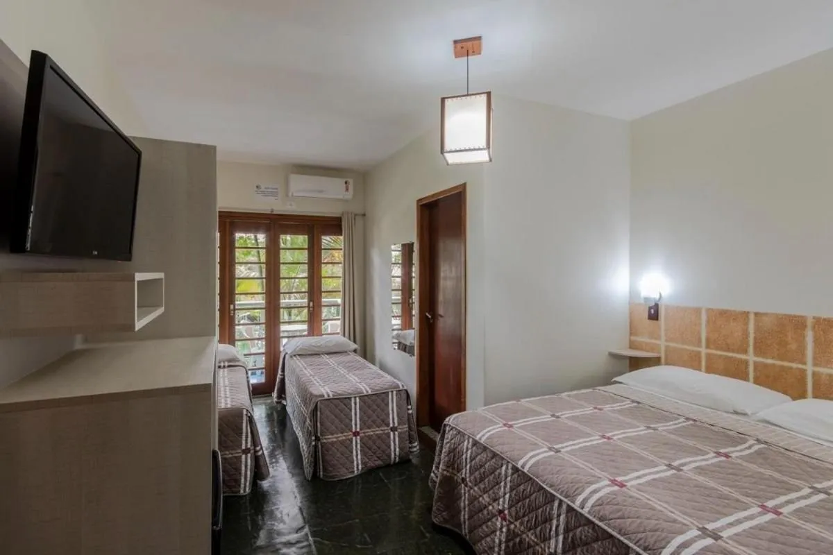 Photo of the whole room, Bed in Pousada Cores do Mar | Conforto com Piscina em Bombinhas