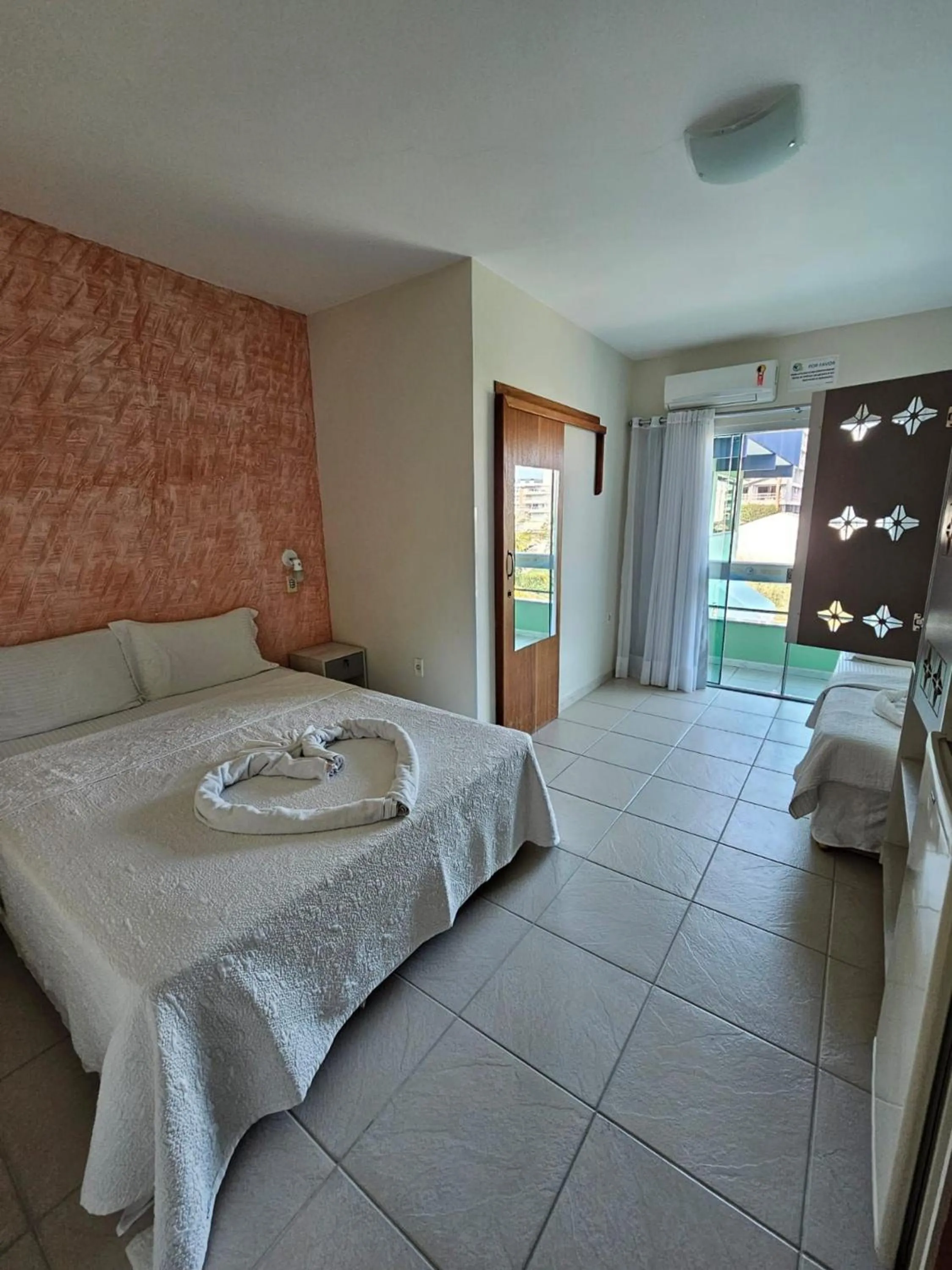 Photo of the whole room, Bed in Pousada Cores do Mar | Conforto com Piscina em Bombinhas