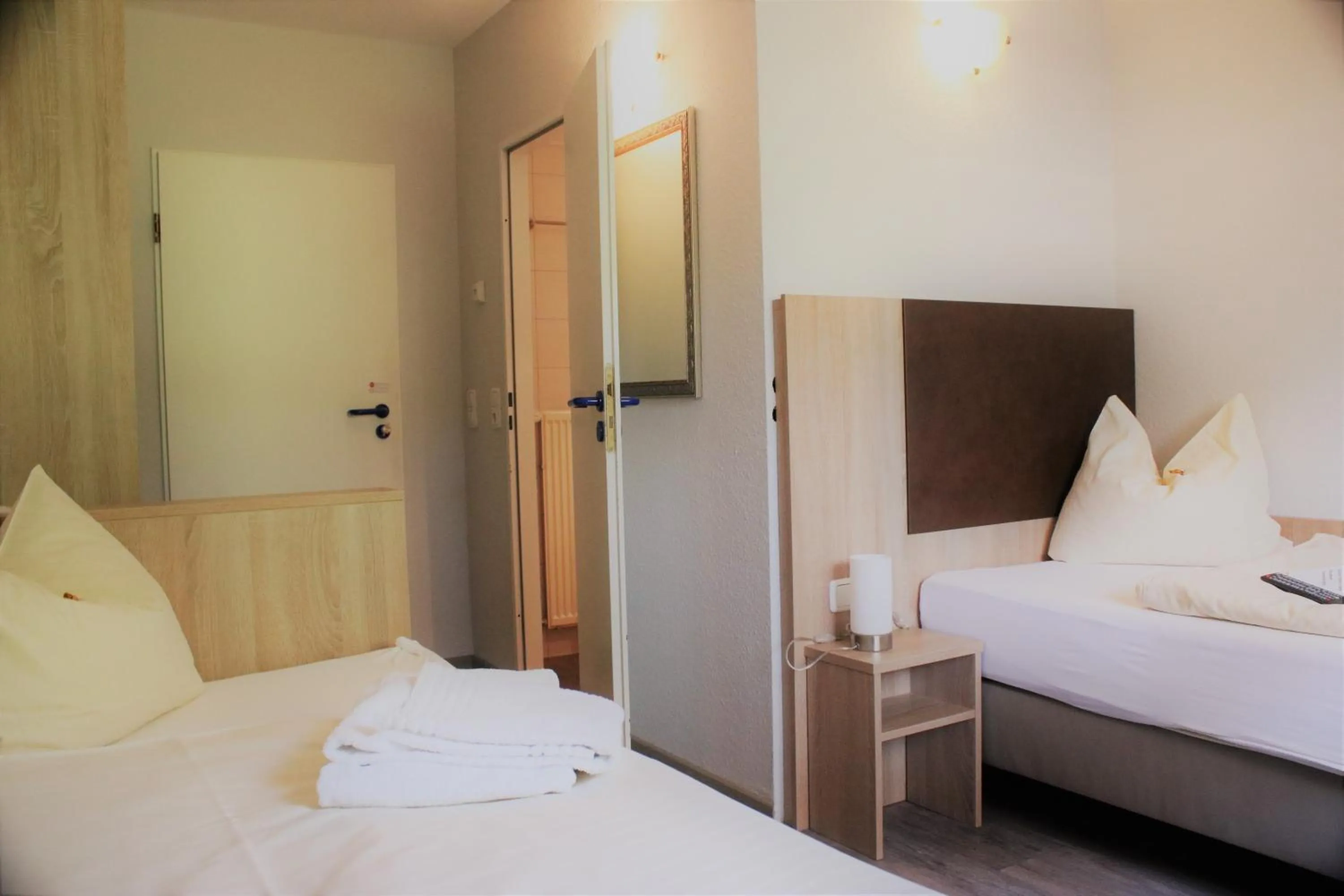 Photo of the whole room, Bed in Tüxen Hotel & Restaurant