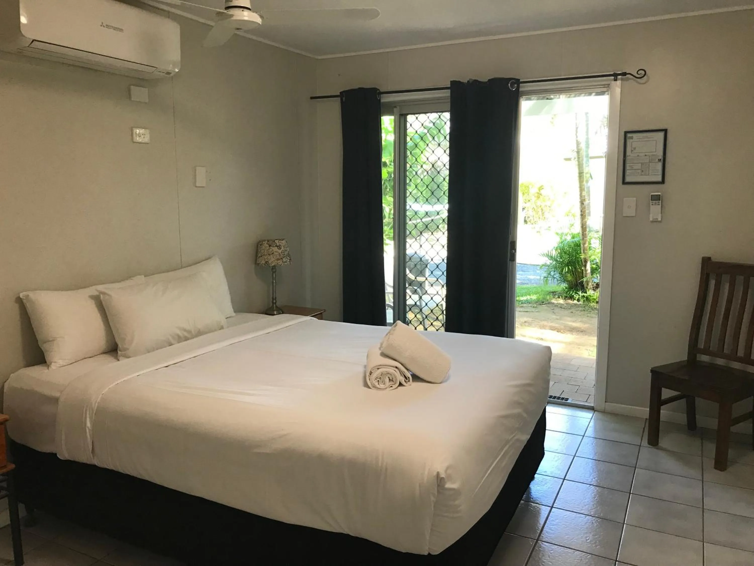 Bed in Bush Village Holiday Cabins