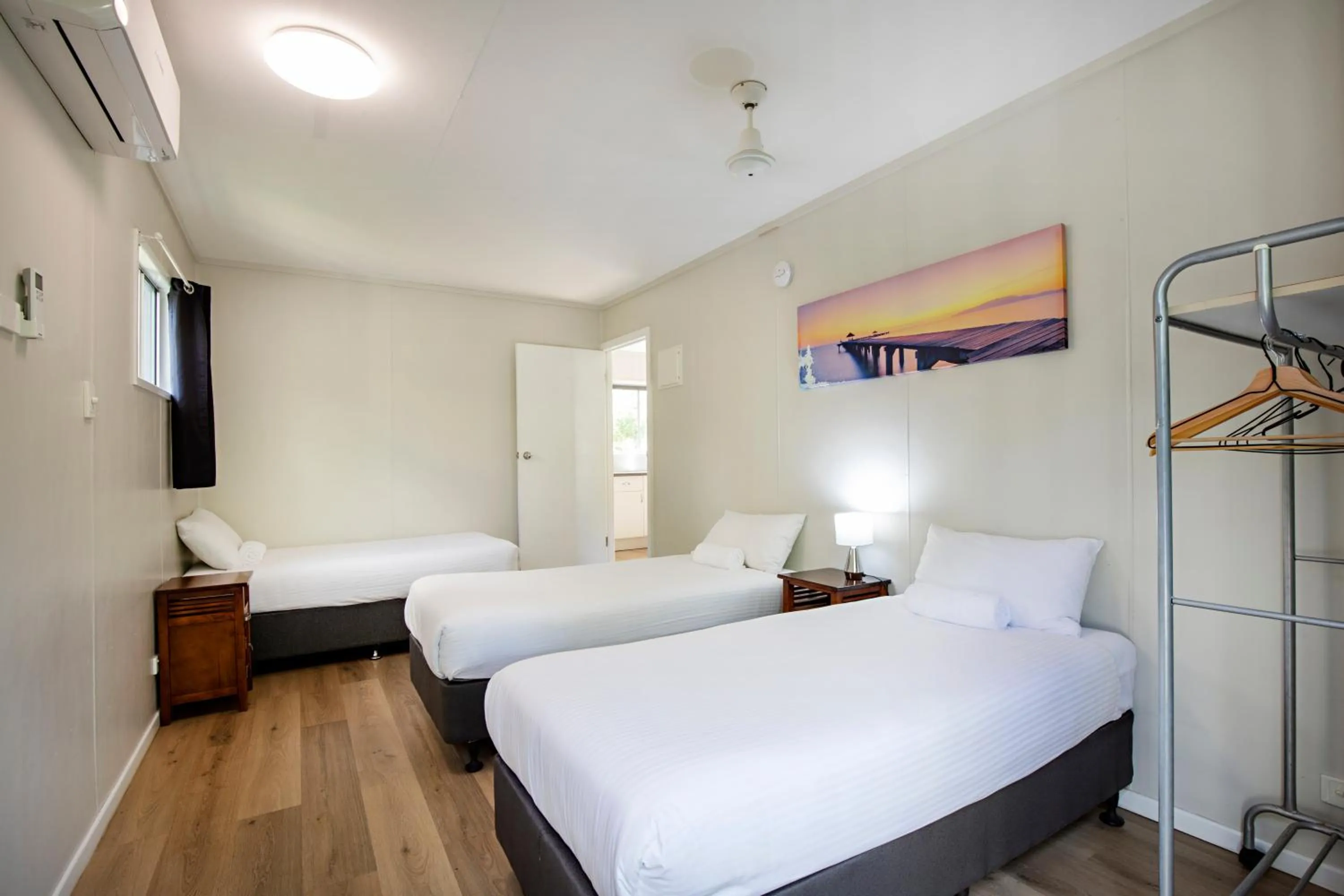 Bed in Bush Village Holiday Cabins