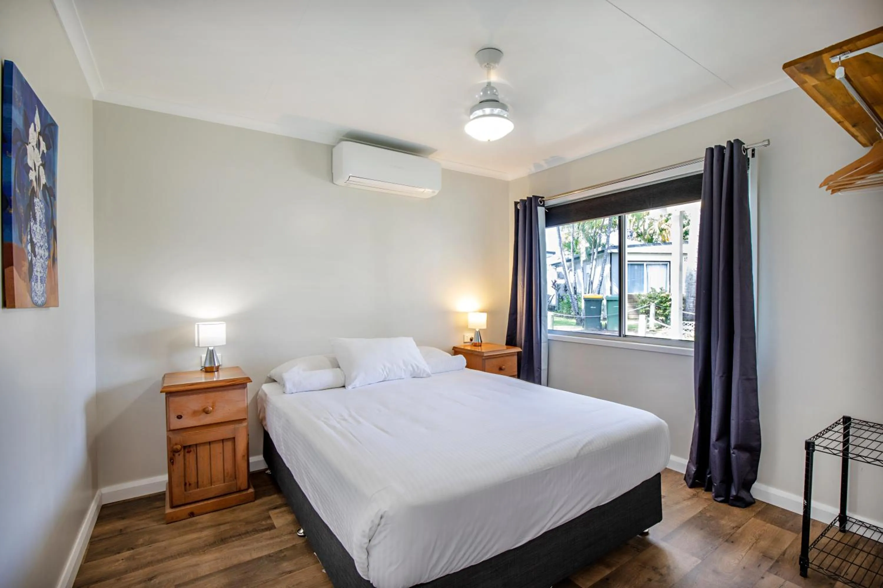 Bed in Bush Village Holiday Cabins