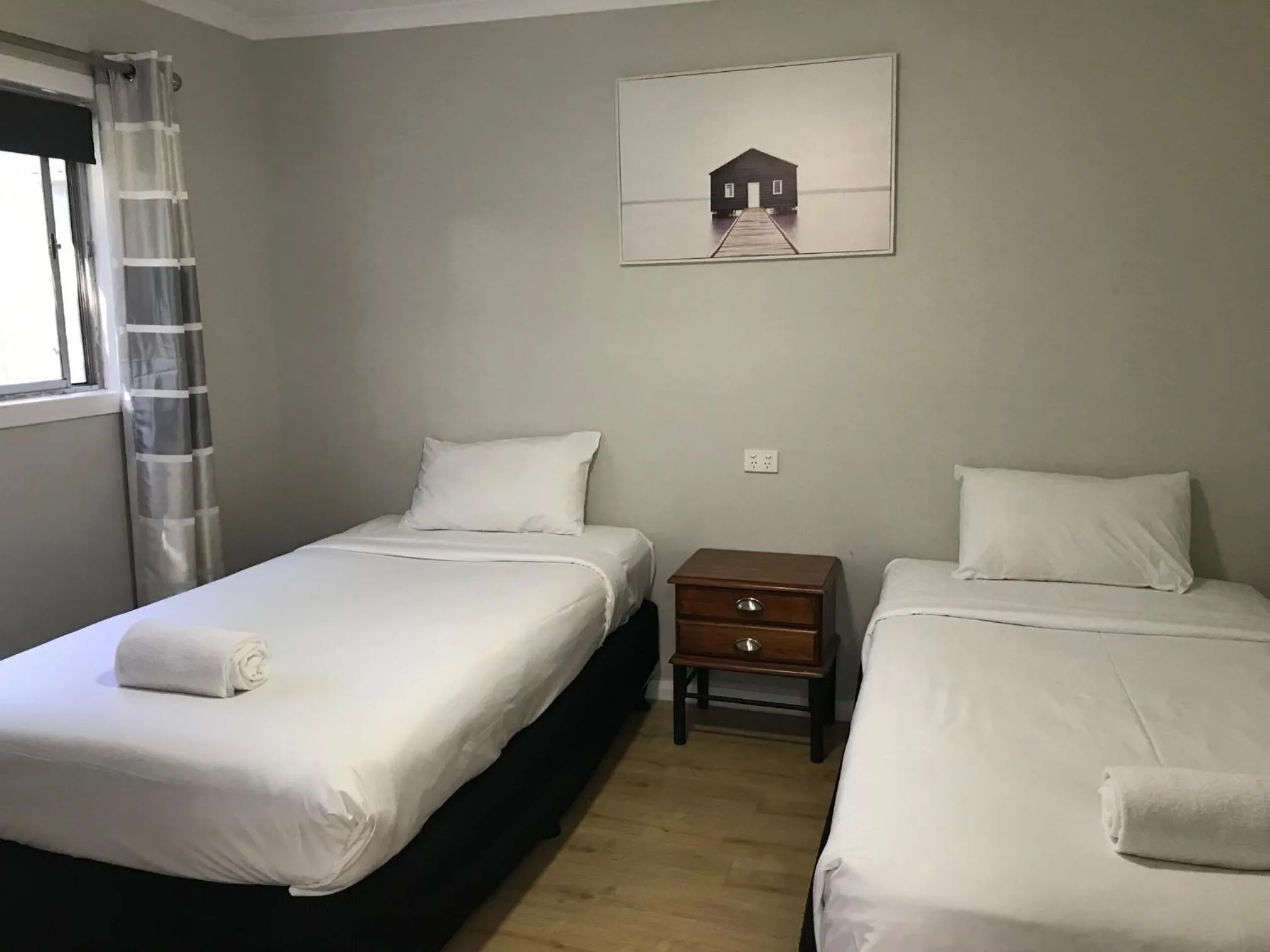 Bed in Bush Village Holiday Cabins