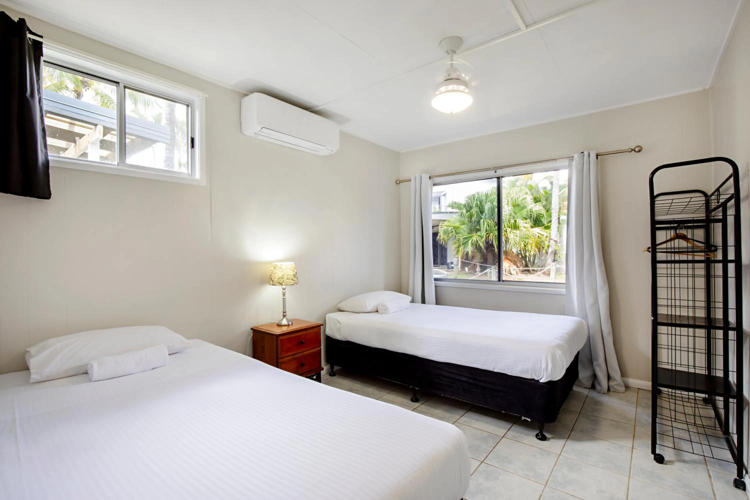 Bed in Bush Village Holiday Cabins