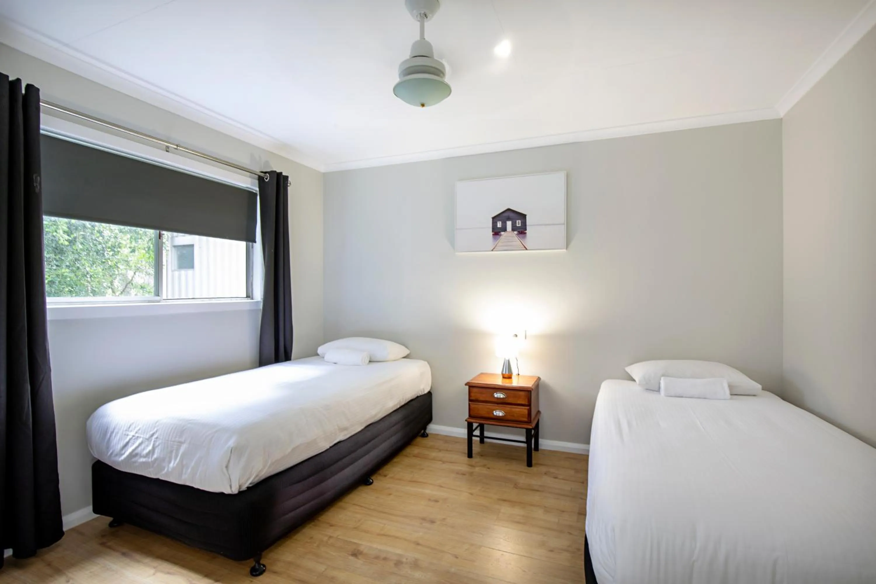 Bed in Bush Village Holiday Cabins