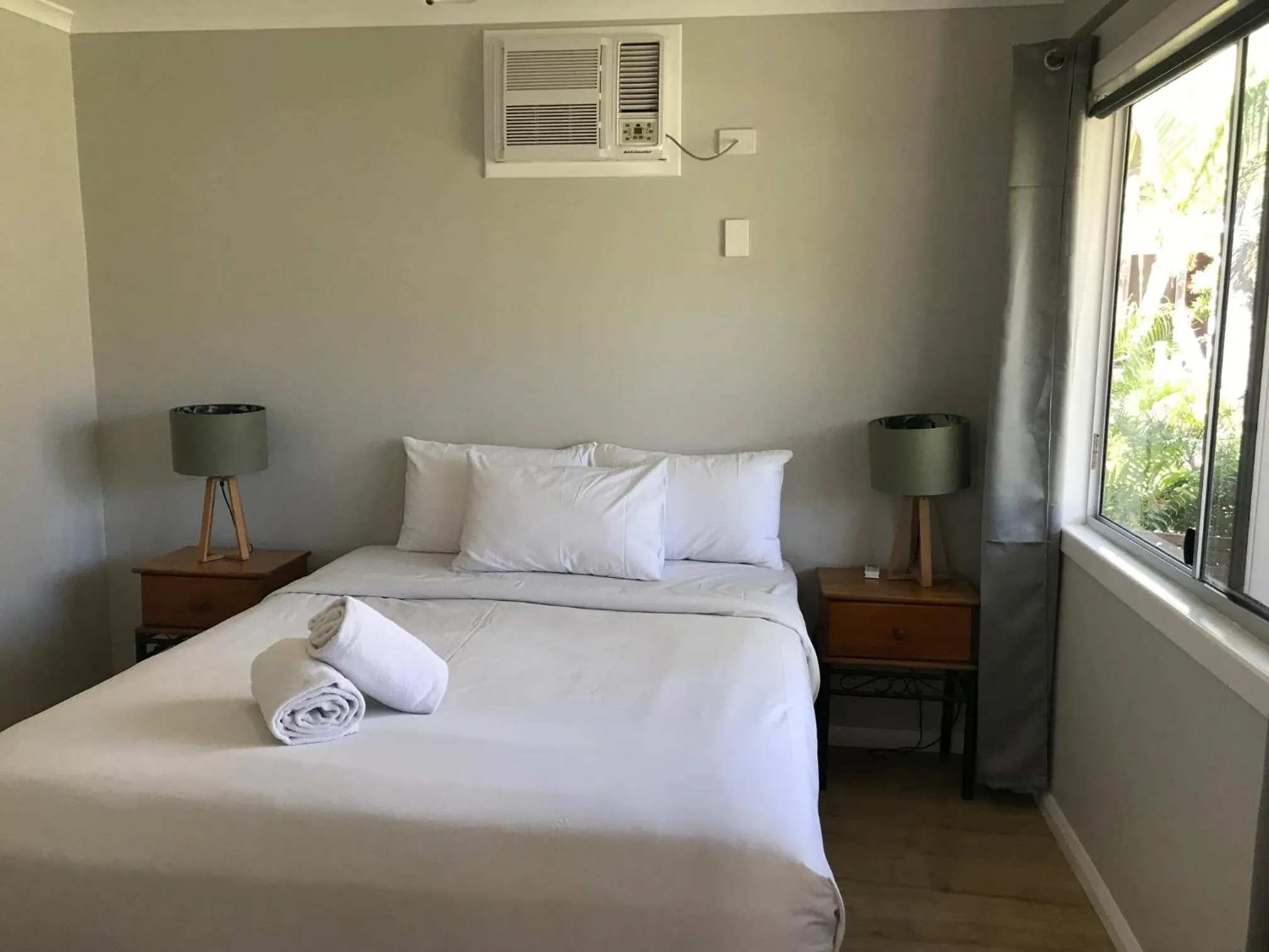 Bed in Bush Village Holiday Cabins