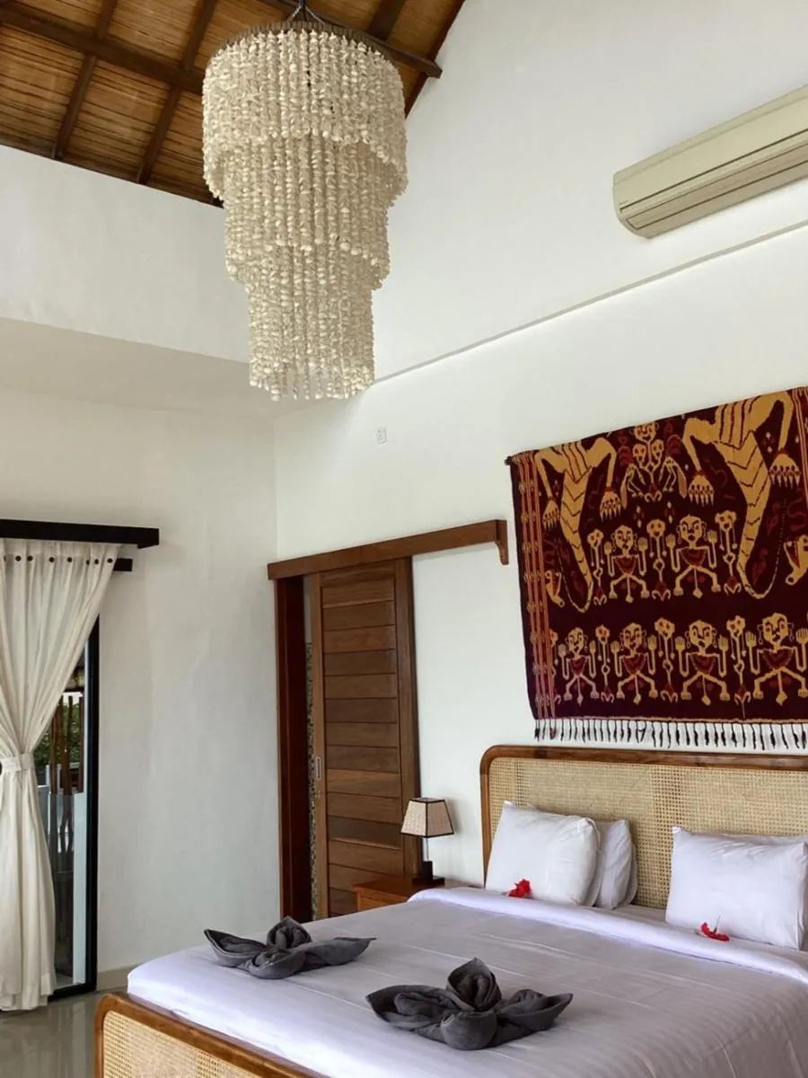 Bed in Puri Oka Beach Bungalows